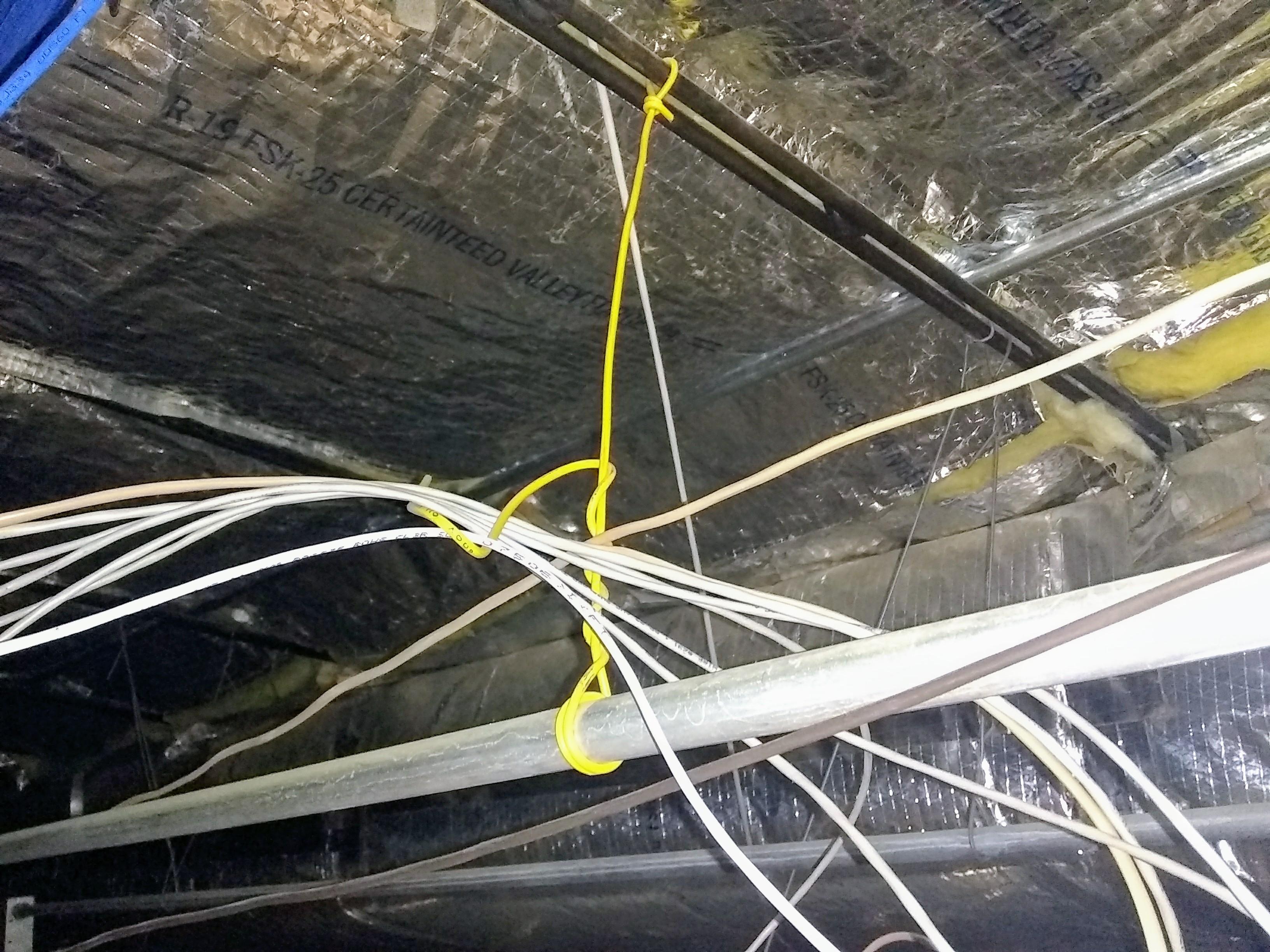 One way to support an electrical conduit. Atleast it is tied to