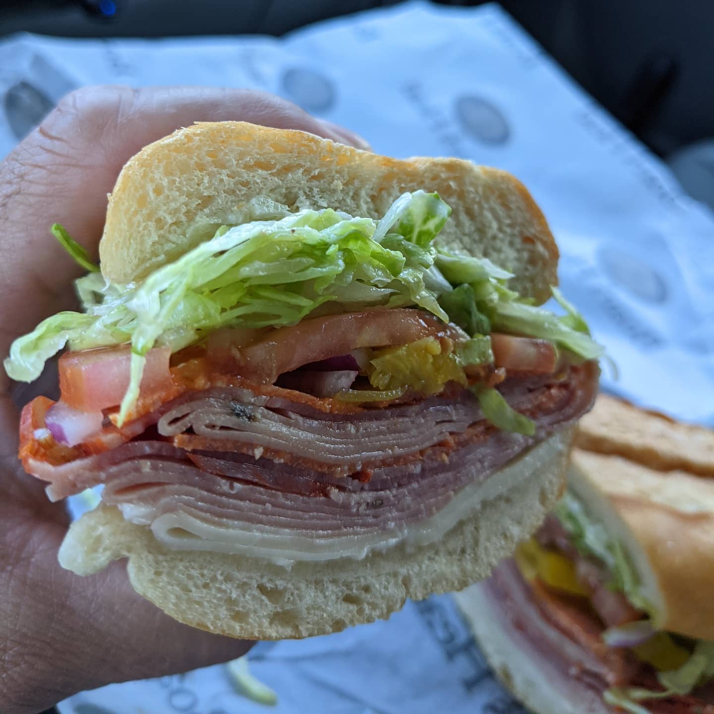 Salami, speck, scamorza, with lettuce, pickles, olive oil and mayo, on