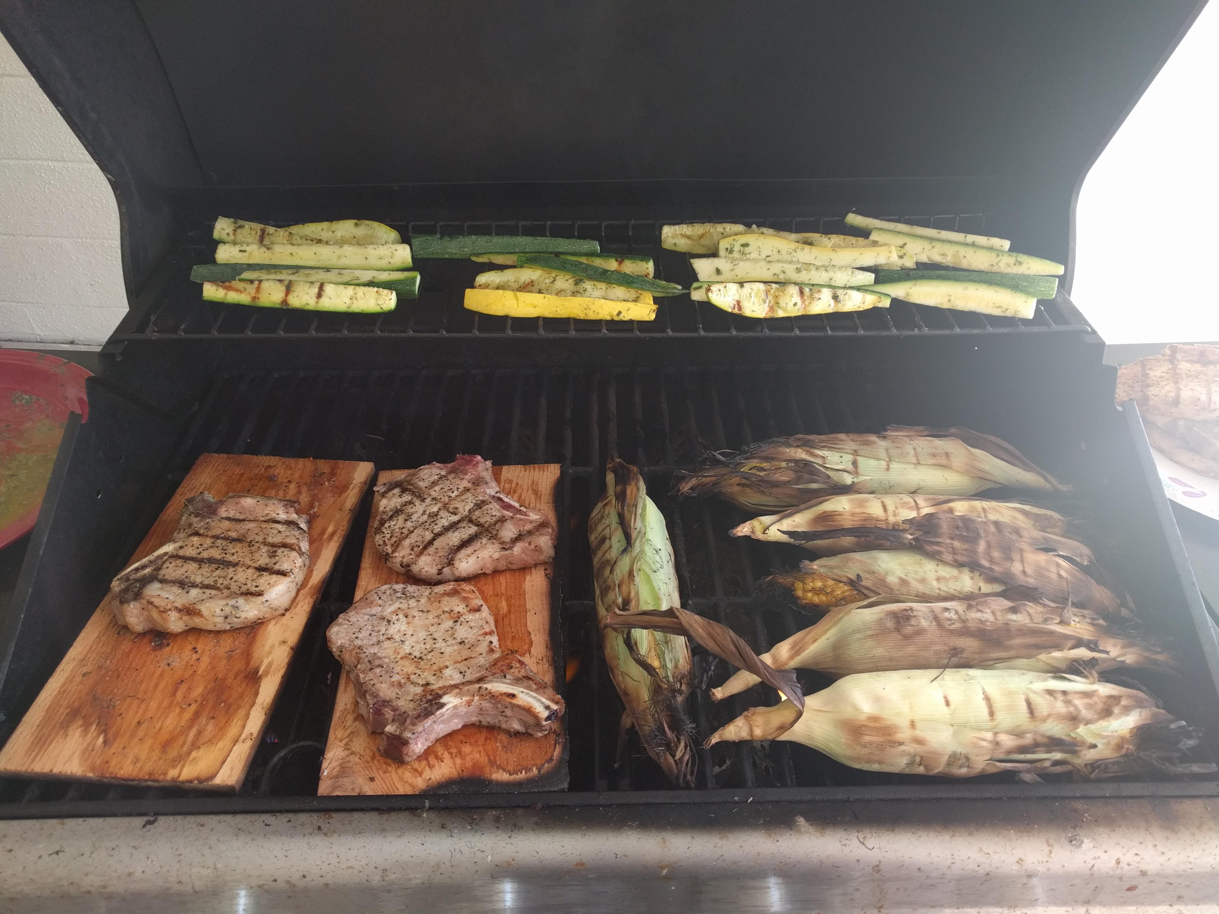 [Homemade] Cedar Plank Grilled Pork chops, Corn on the Cob, and Garlic