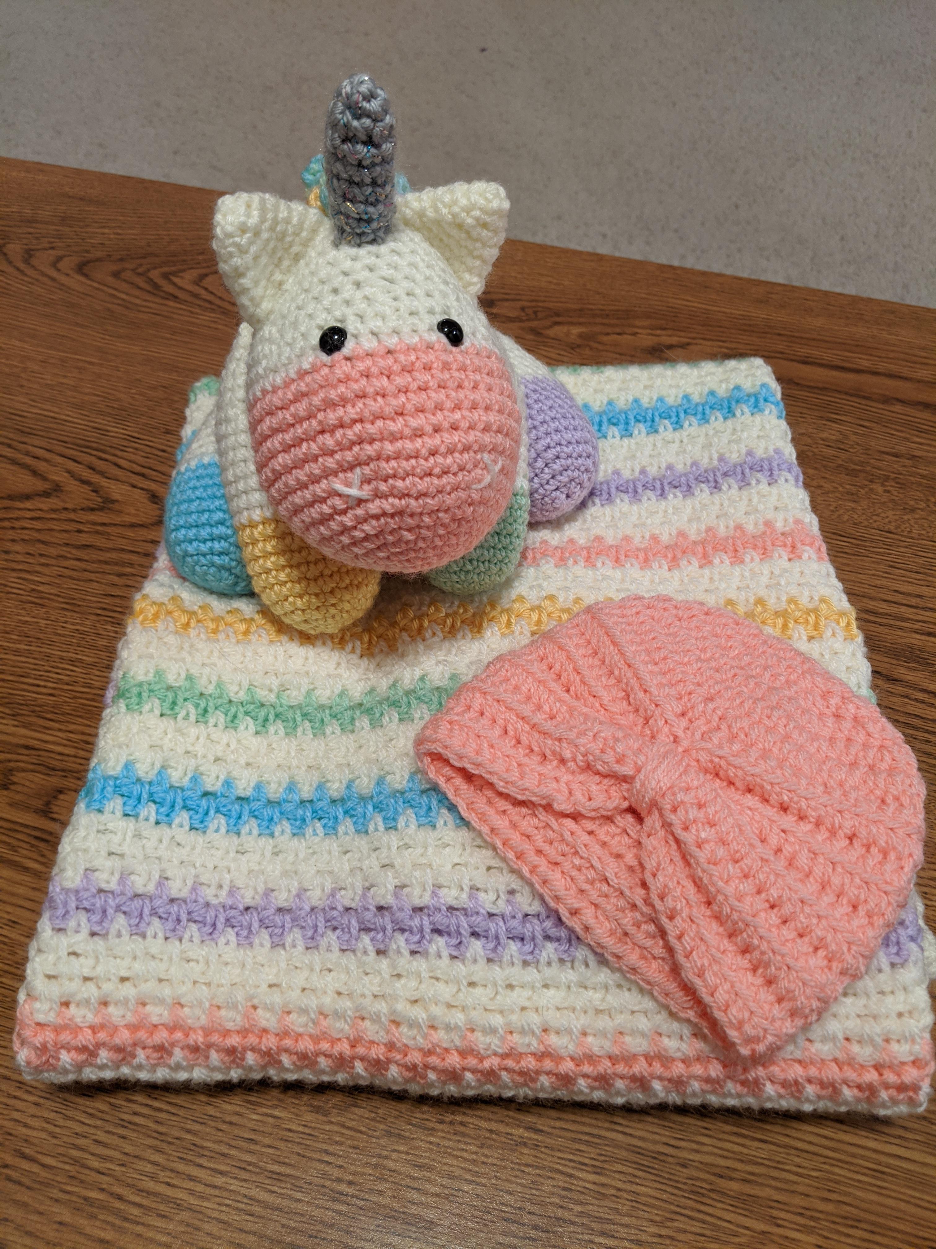 Rainbow blanket, unicorn, and hat for my friend's rainbow baby. r/crochet