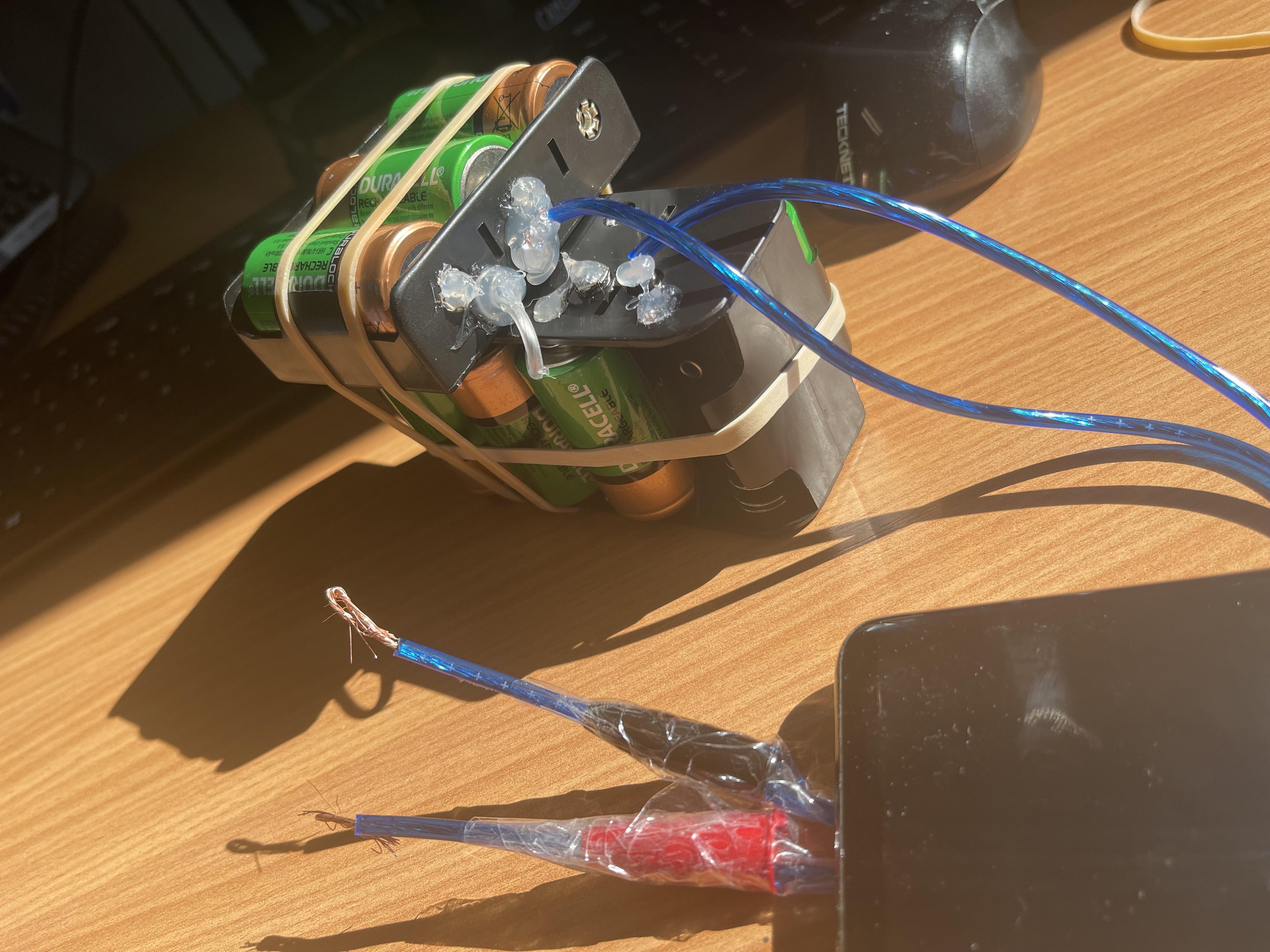 Made a new gadget for camping next weekend. 13 1.2v batteries in series to run 12 volt items