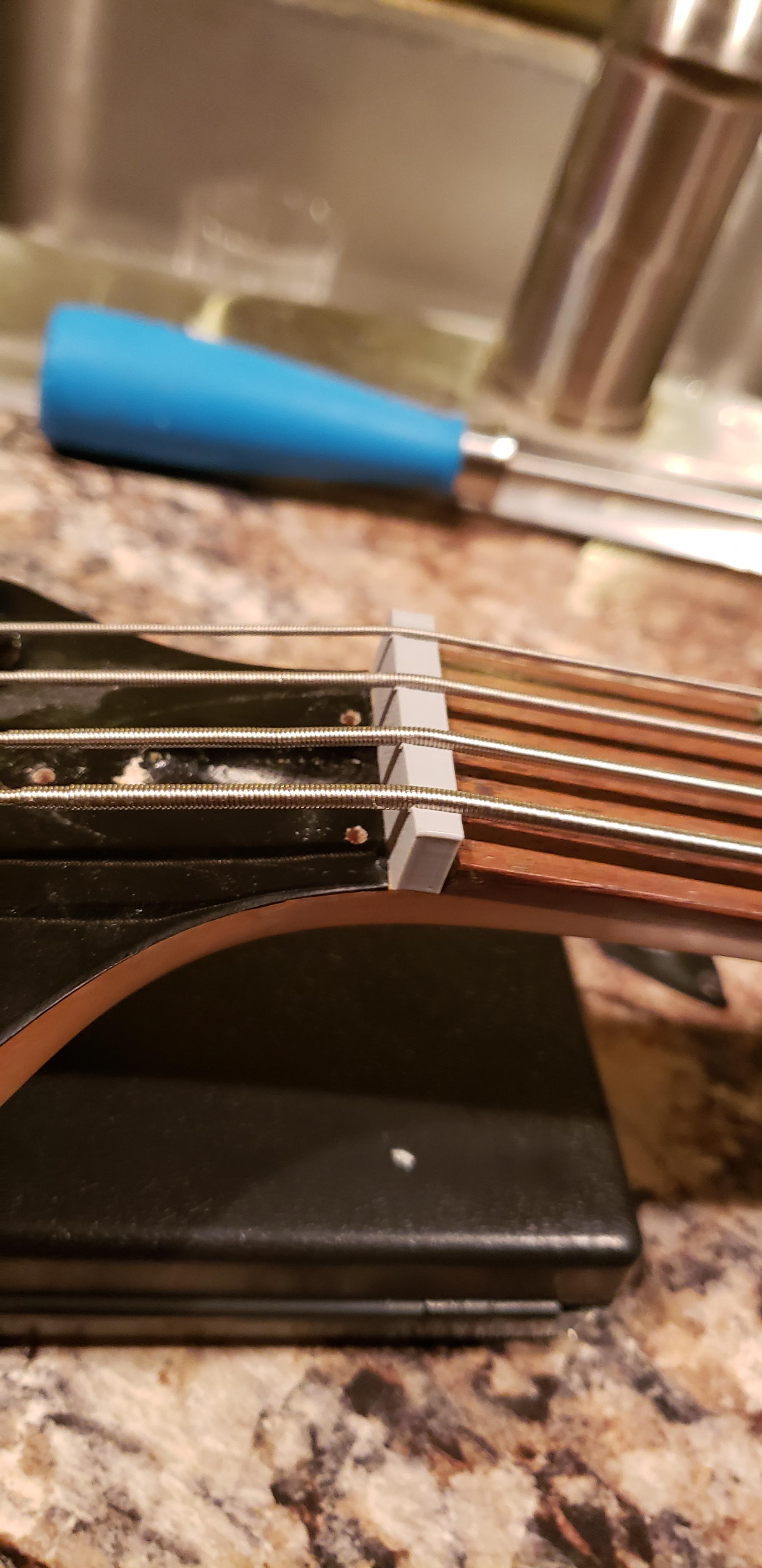 Replaced a broken bass nut with one of my own for less than 5 cents