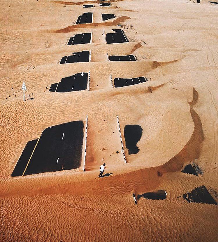 Sand dune moving over a highway in Dubai, UAE r/interestingasfuck