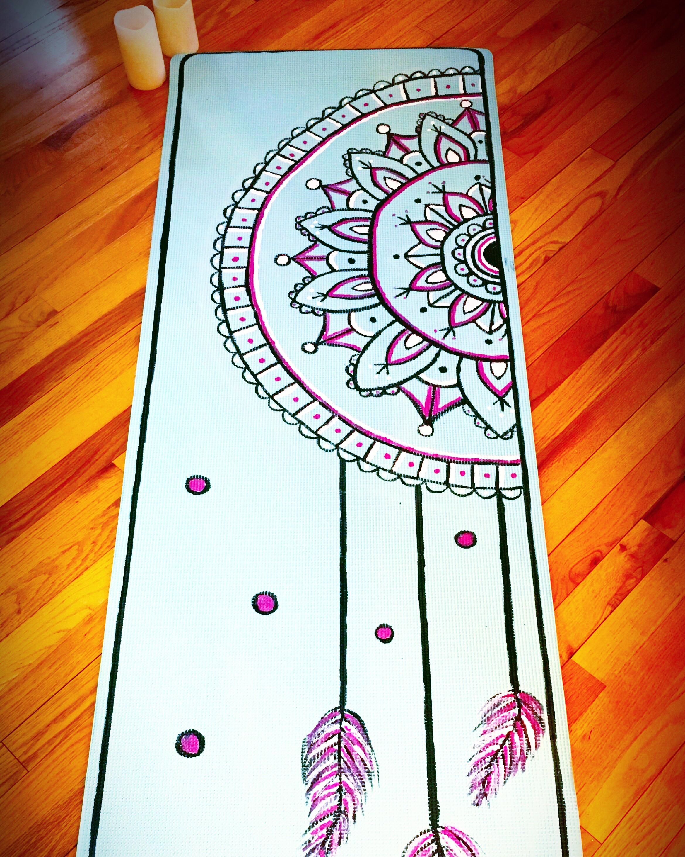 Found this iridescent teal yoga mat and had to paint a dream catcher on