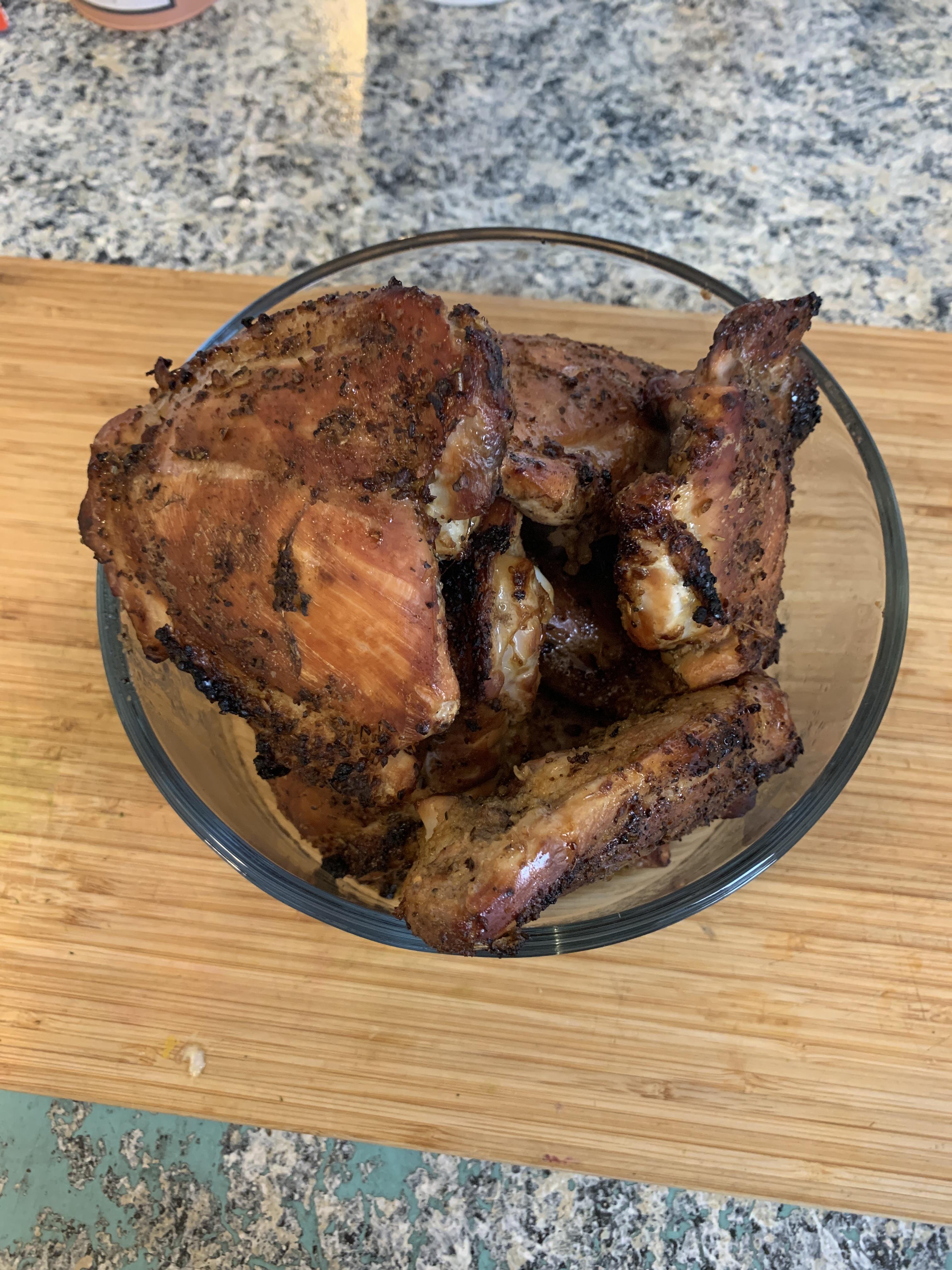 Chicken thighs in an electric smoker with er chicken rub. 1 hour