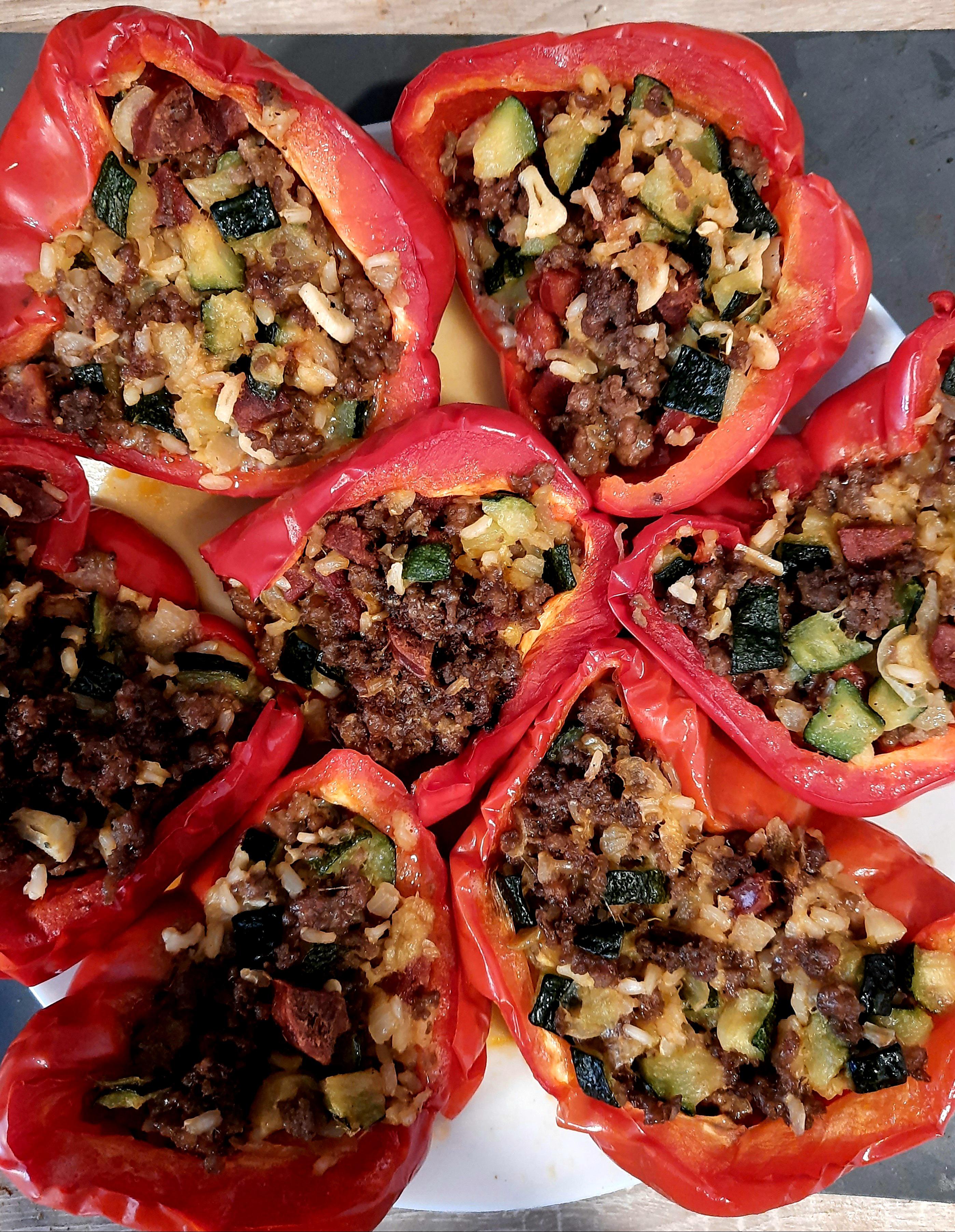 Bell peppers stuffed with ground beef, sausage, mozarella cheese