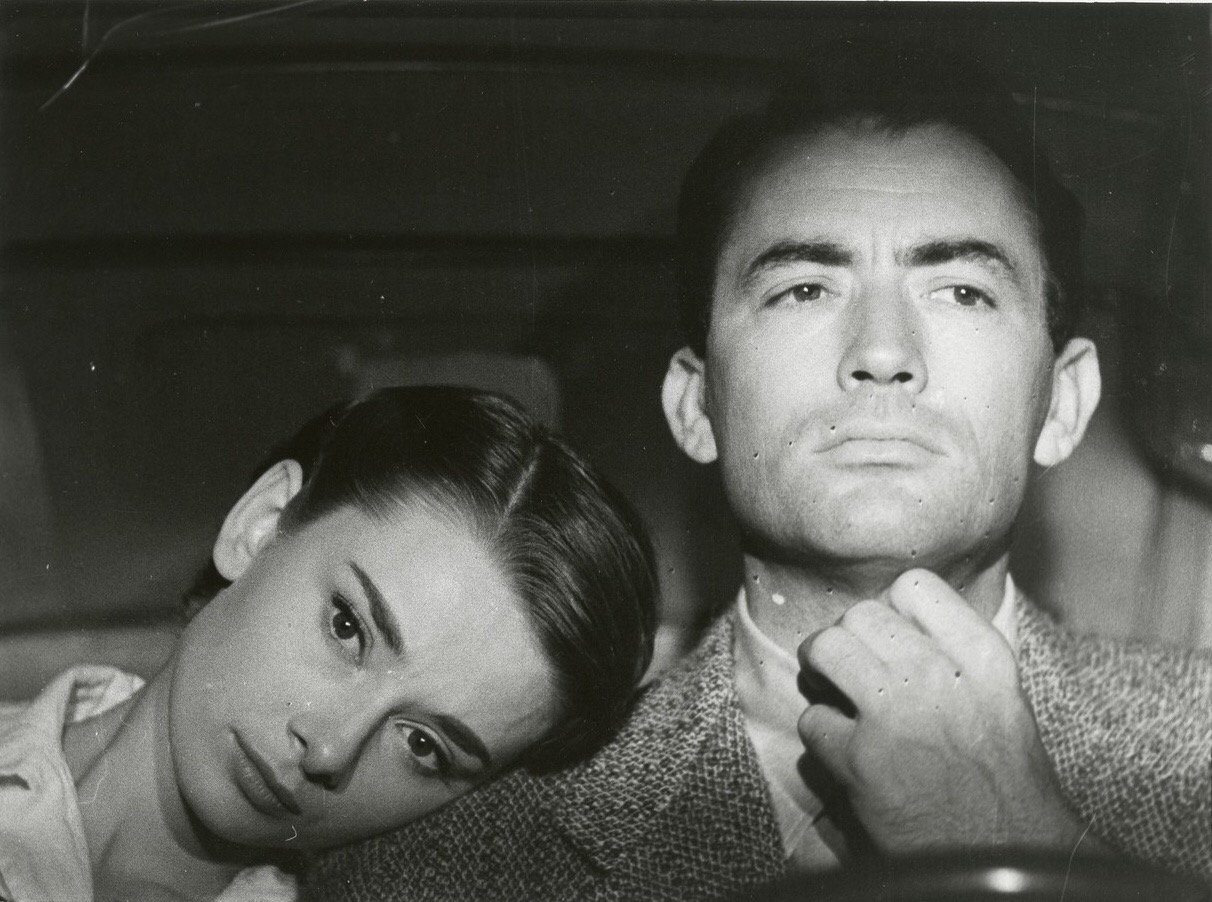 Audrey Hepburn and Gregory Peck on a scene in Roman Holiday (1953) r