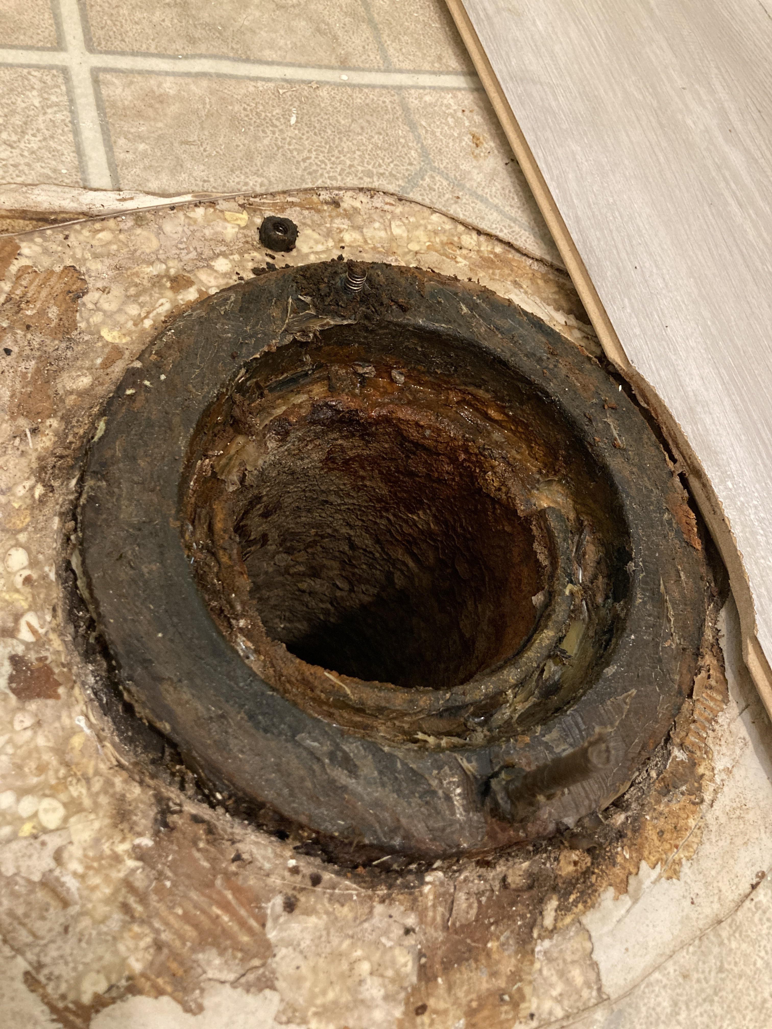 Help with toilet flange... broken bolt and the floor is rising by 1/2
