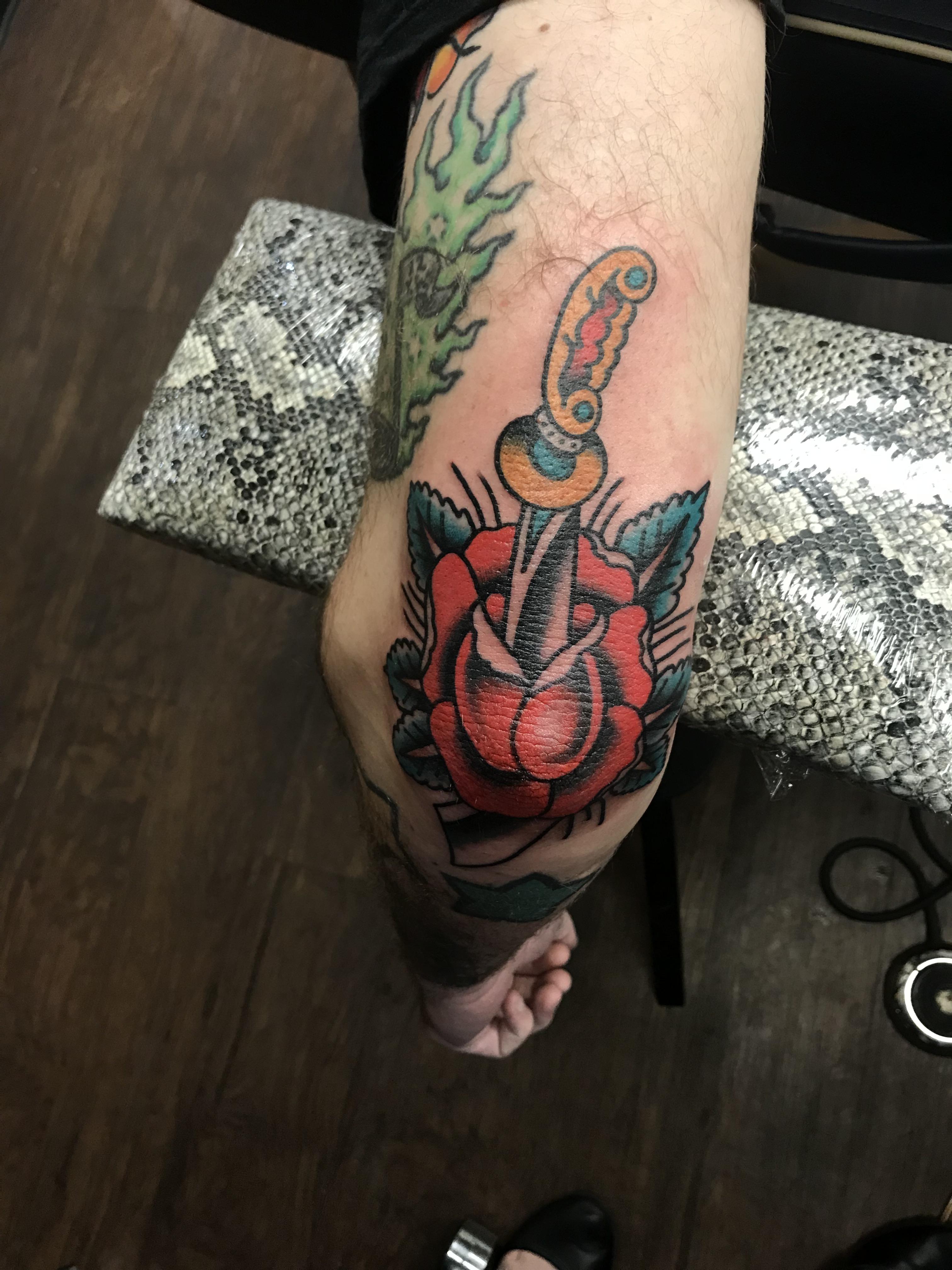 Rose and dagger elbow tattoo by Amanda at Downtown Tattoo