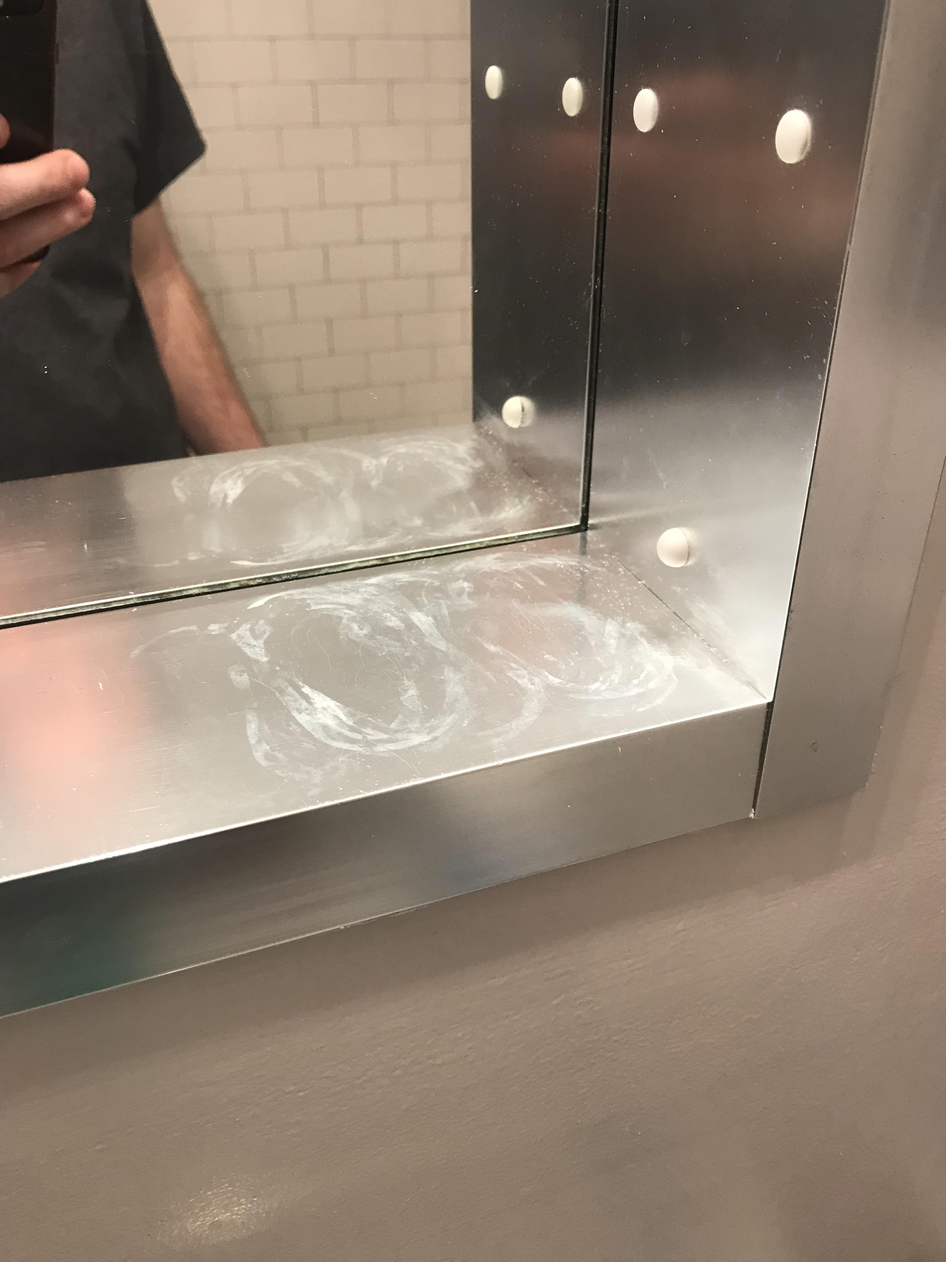 How to remove this stain from this metallic surface in my bathroom