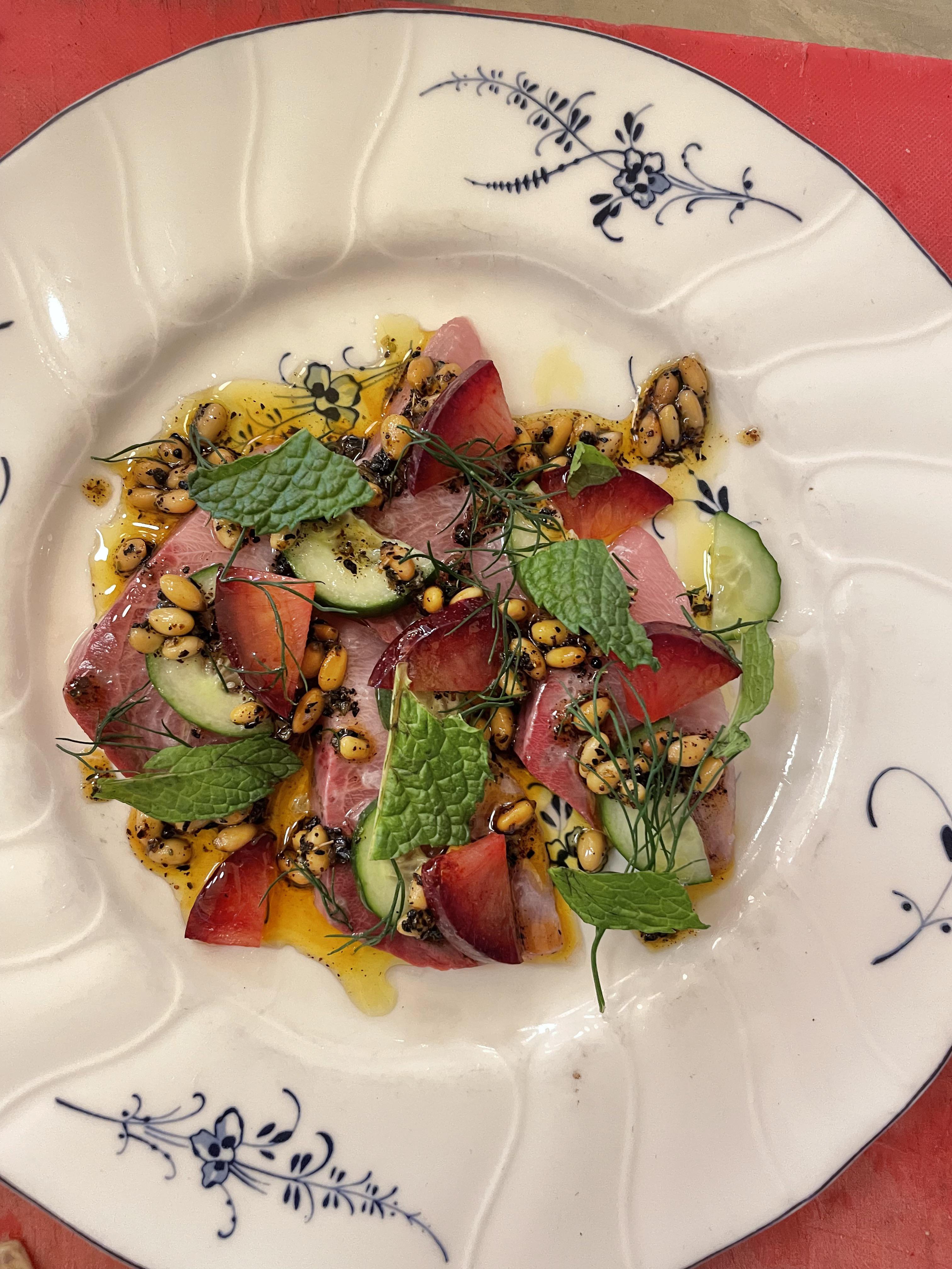Hamachi yellowtail crudo, Persian cucumber, pluots, pine nut relish