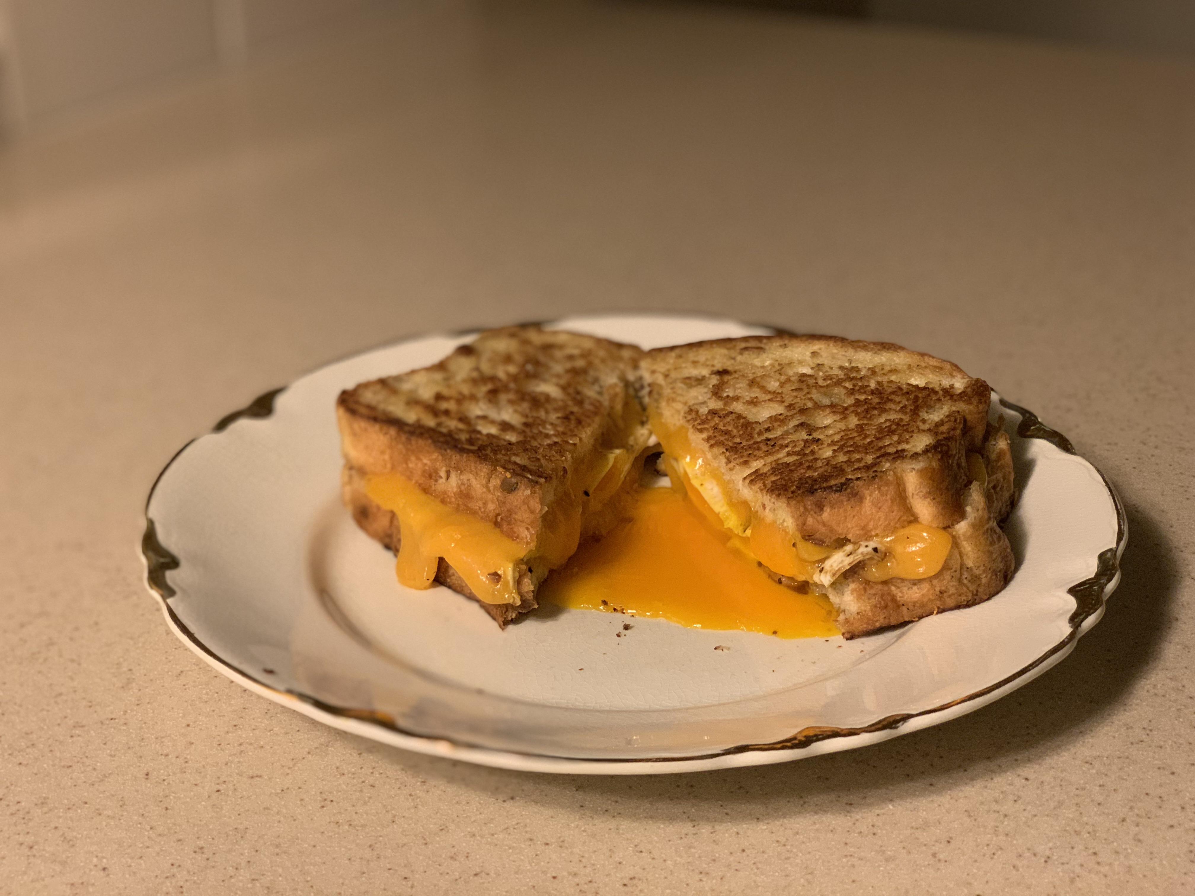 With cheddar and egg added. r/grilledcheese