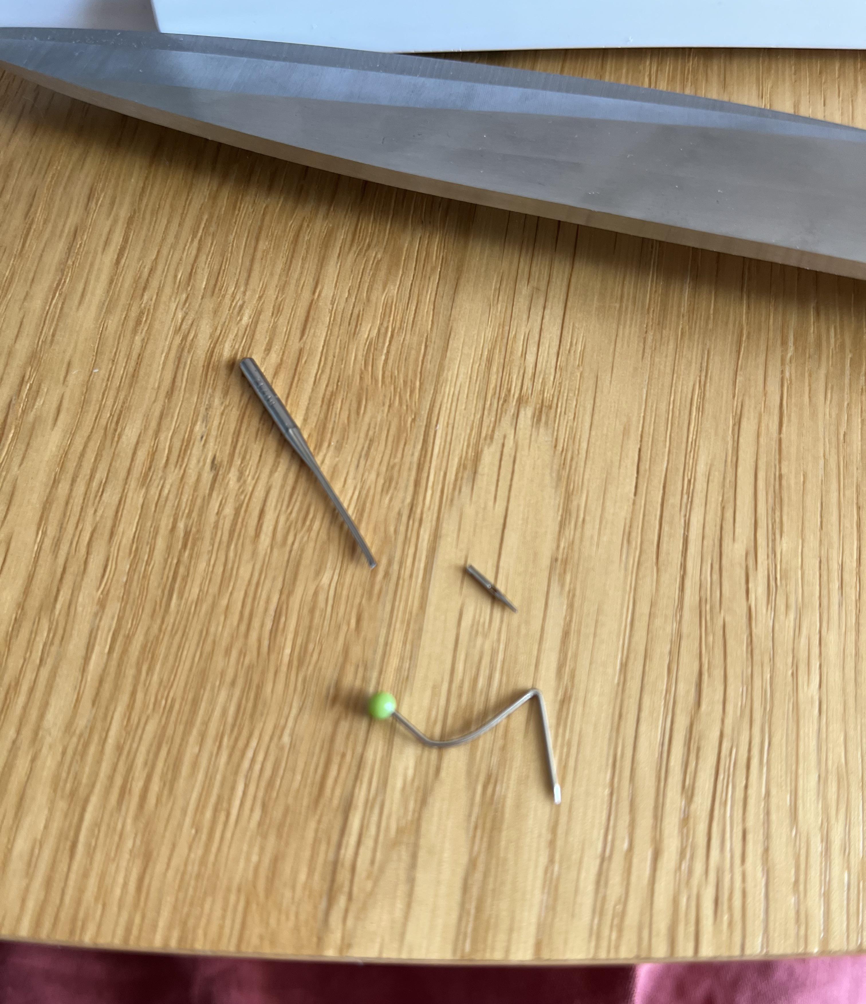 Put the pins in perpendicular and you can sew over them they said r