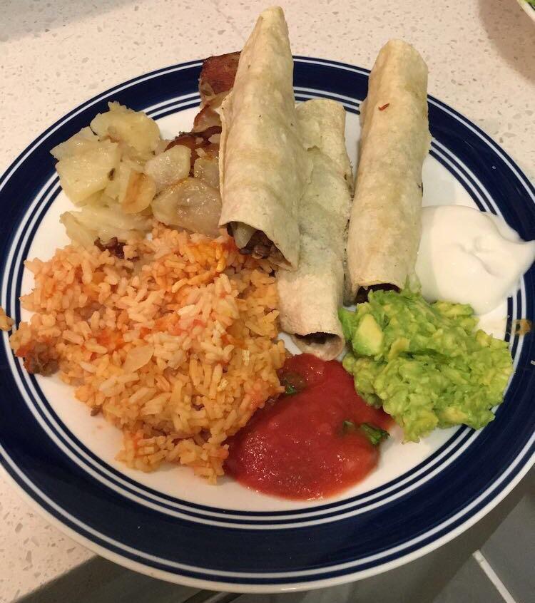 Baked Lentil Taquitos, Fried Potatoes, Spanish Rice, Salsa, Guac