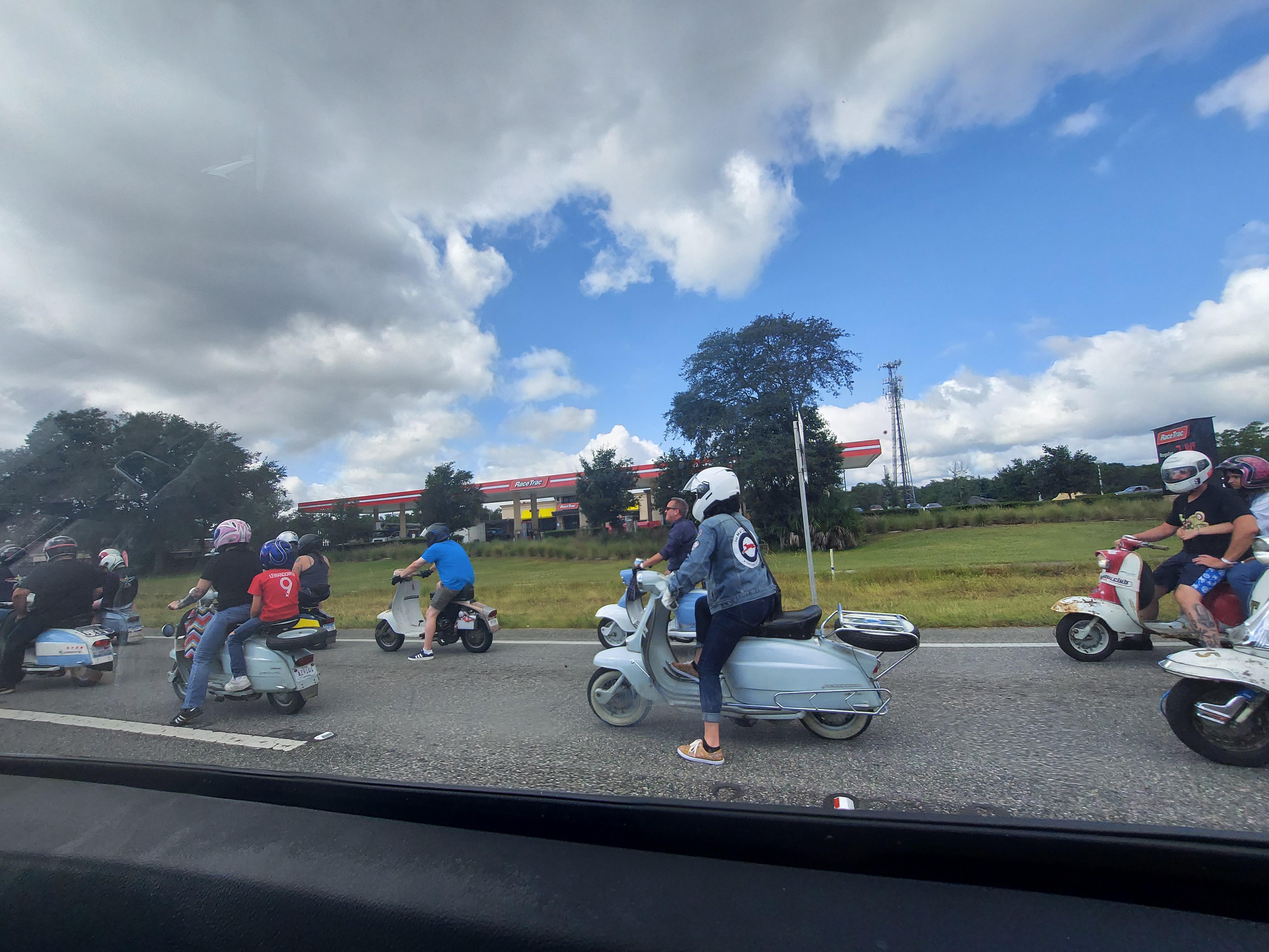 This scooter club is on their way to a Fall foliage trip through Maine