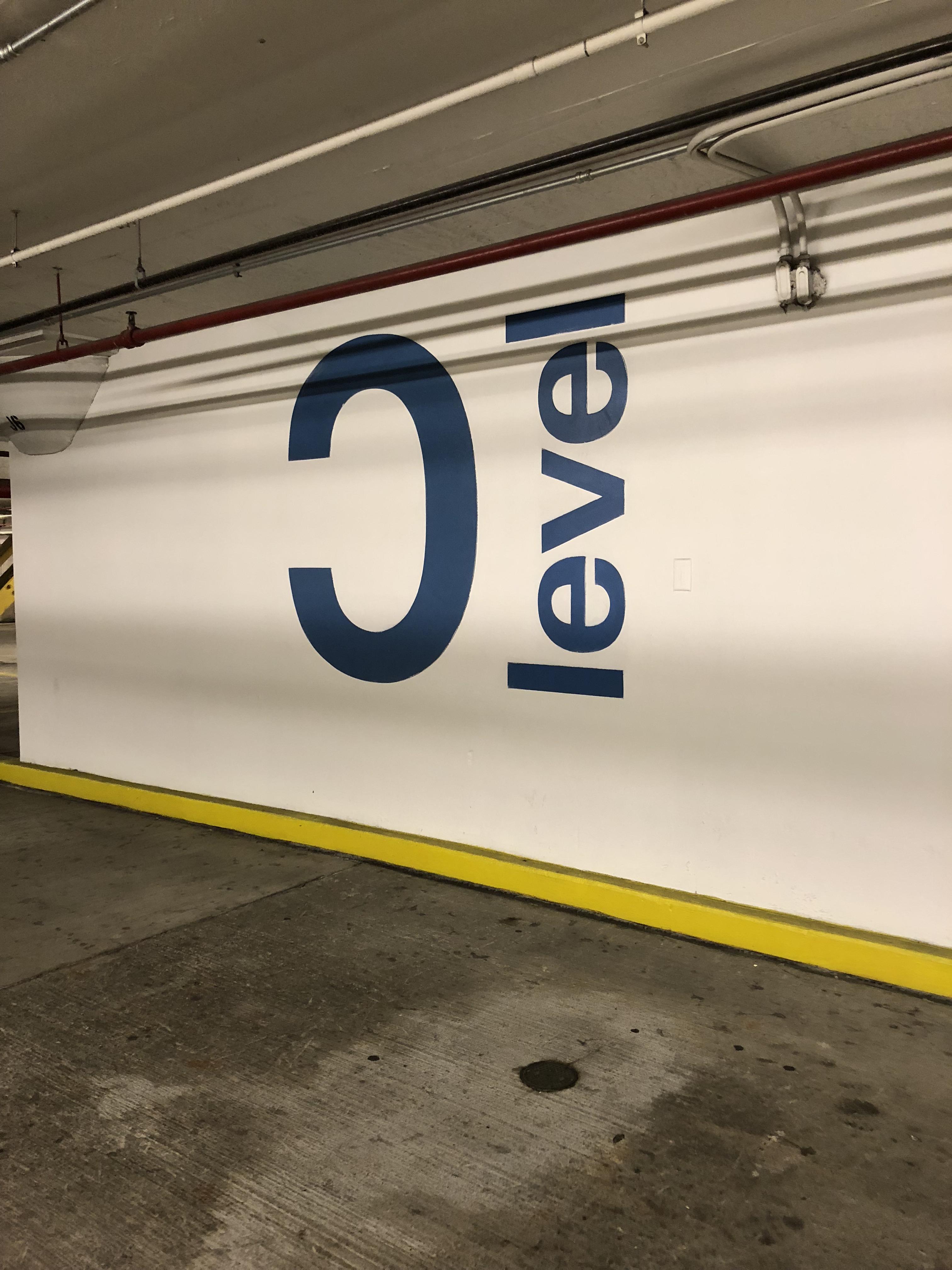 The C is backwards in the Kennedy Center parking lot r/mildlyinteresting