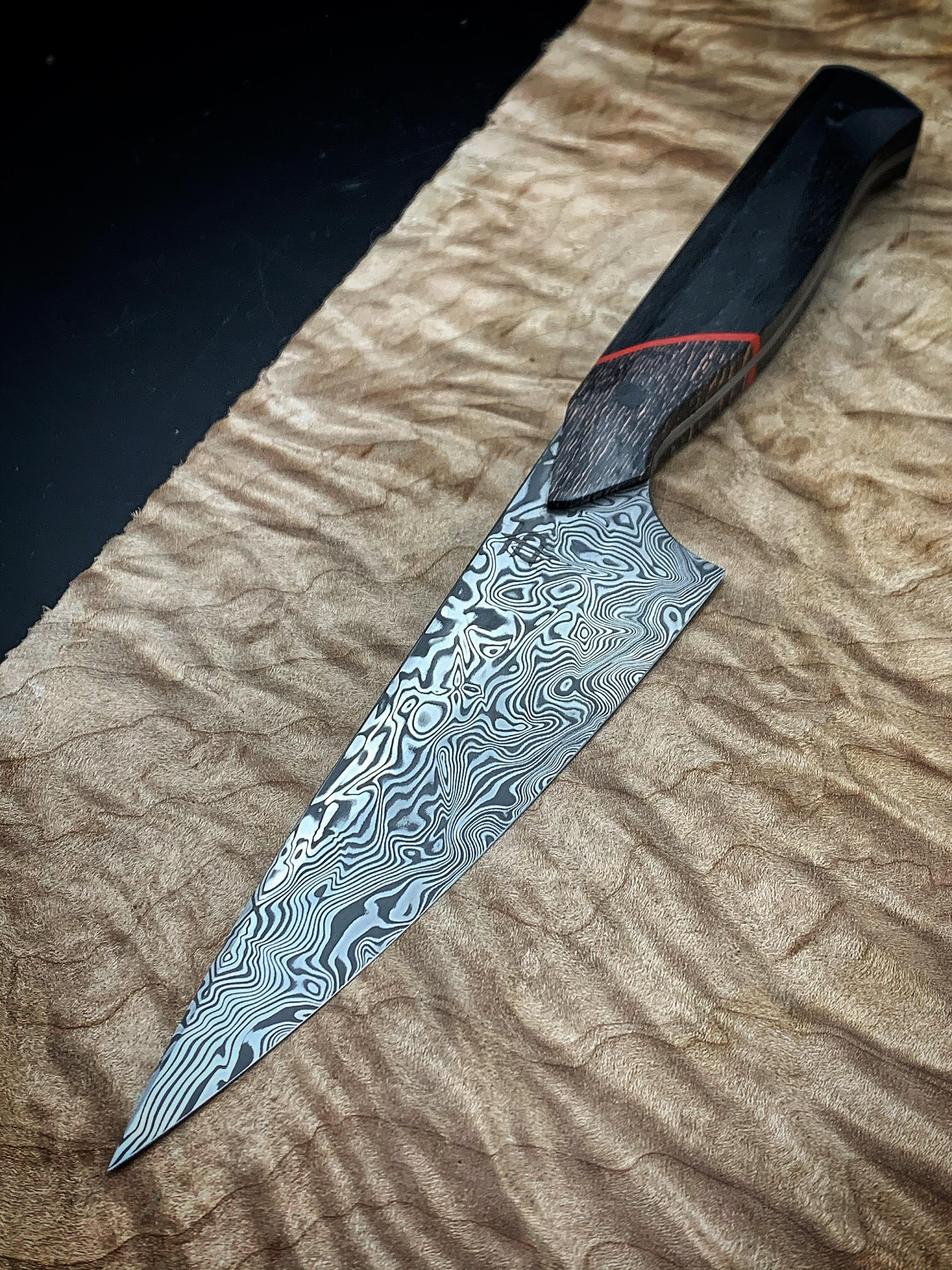 Petty knife I finished yesterday damasteel fat carbon red liner