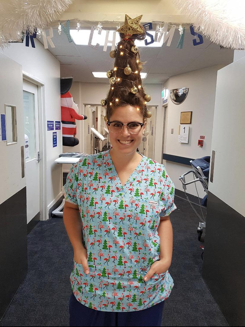 Nurse decorated her hair to try and cheer up her ICU patients over Christmas! r/pics
