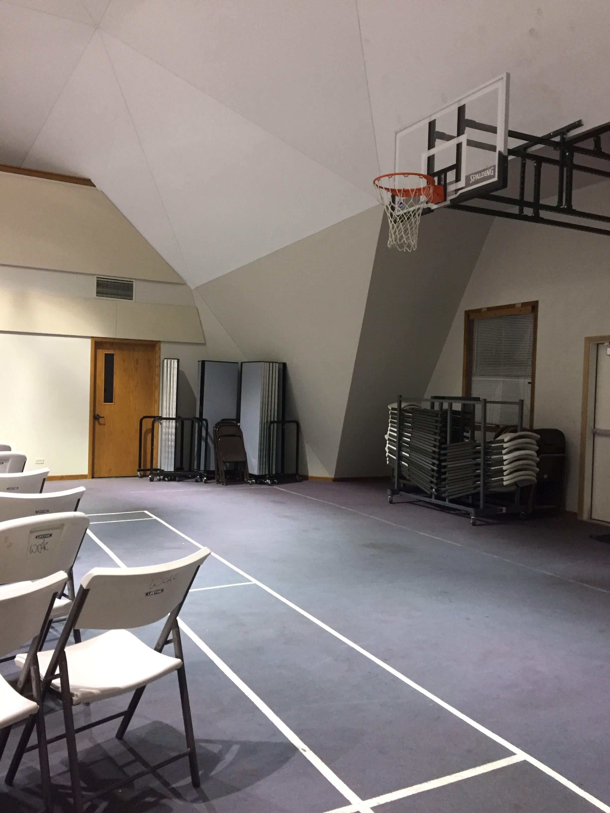 This basketball court has a carpeted floor mildlyinteresting