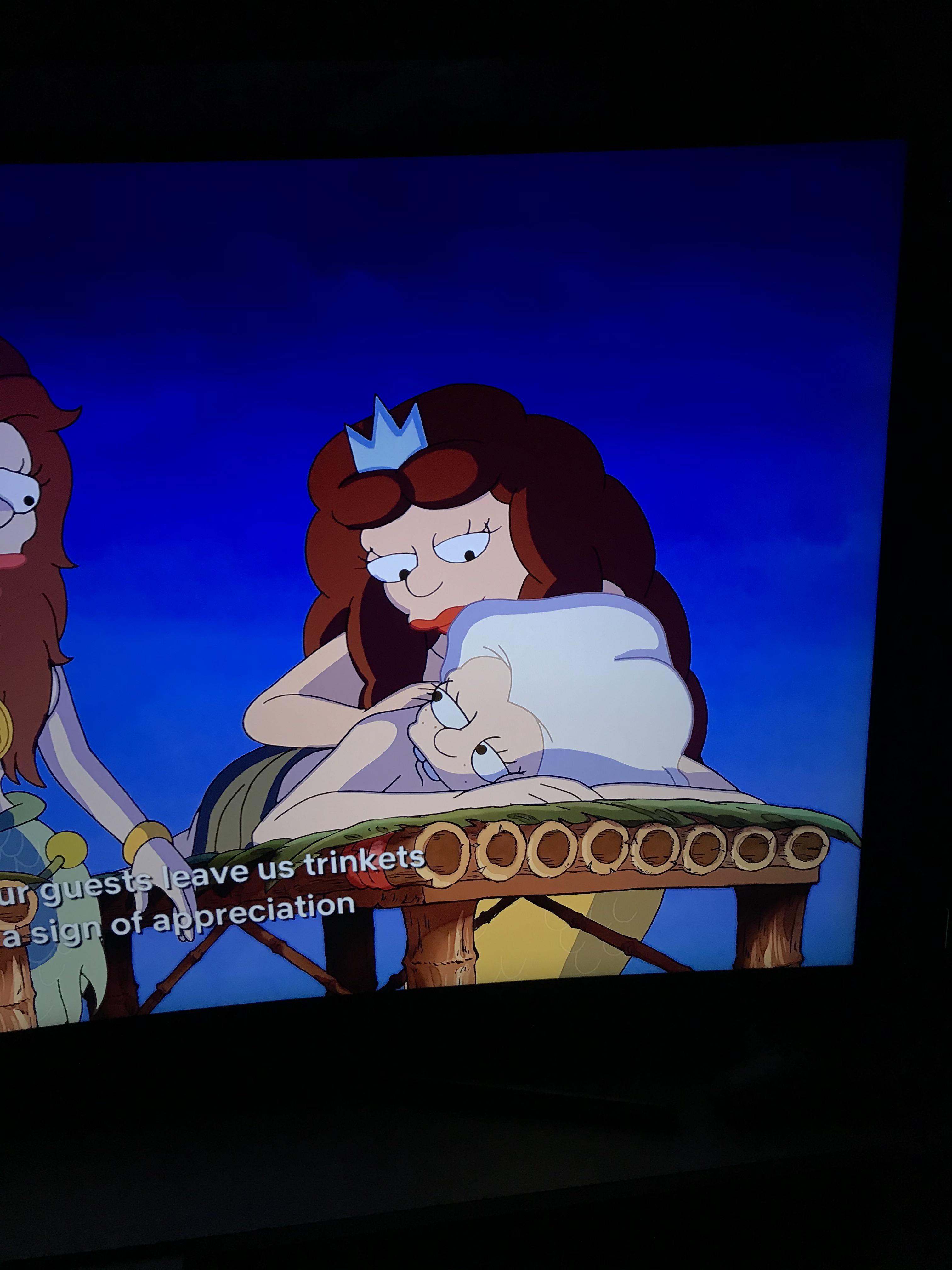 Mora's mother, Queen of Mermaid Island, is the one massaging Bean in