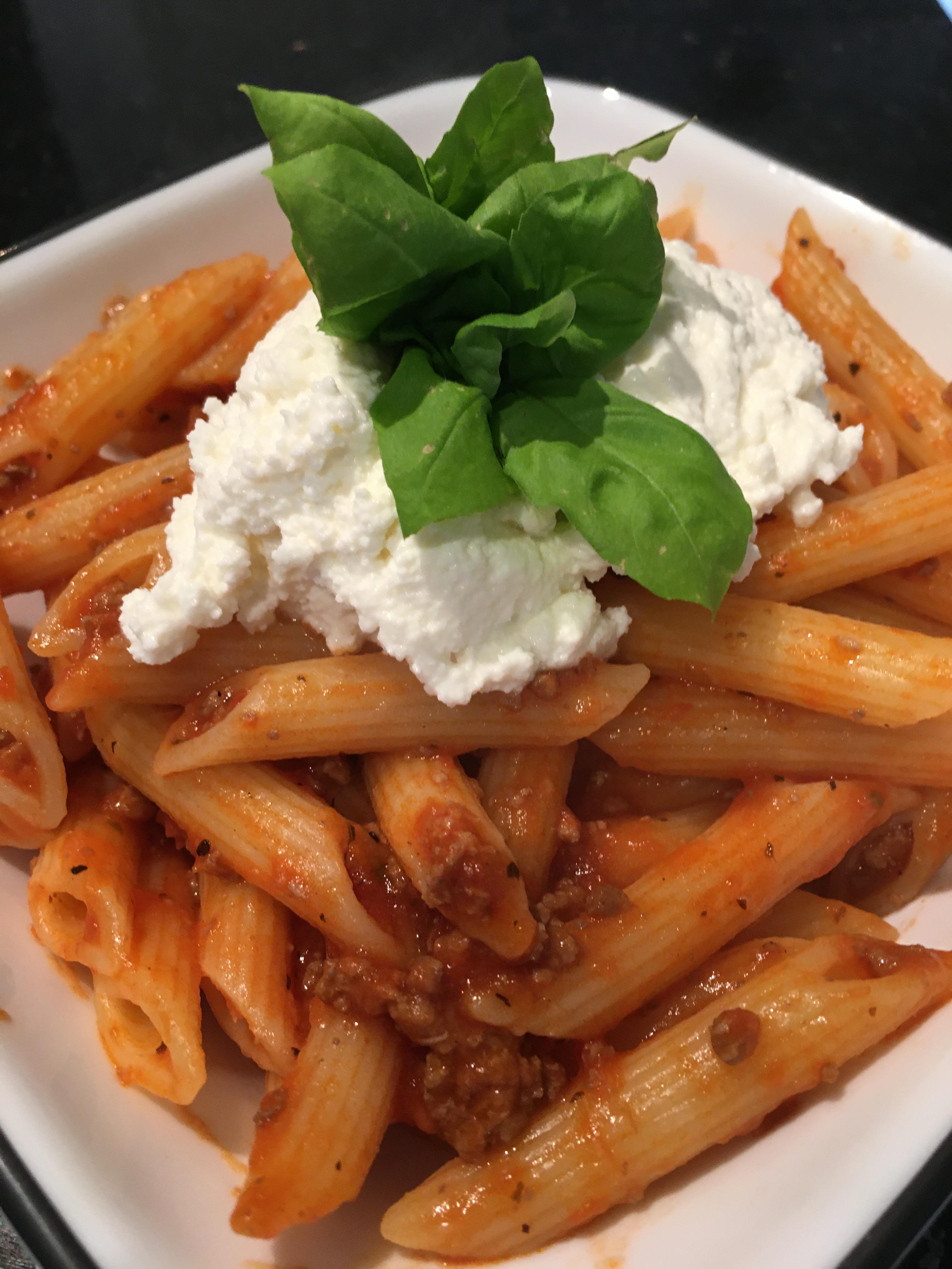 Penne with tomato sauce (with meat) and a wallop of ricotta with fresh