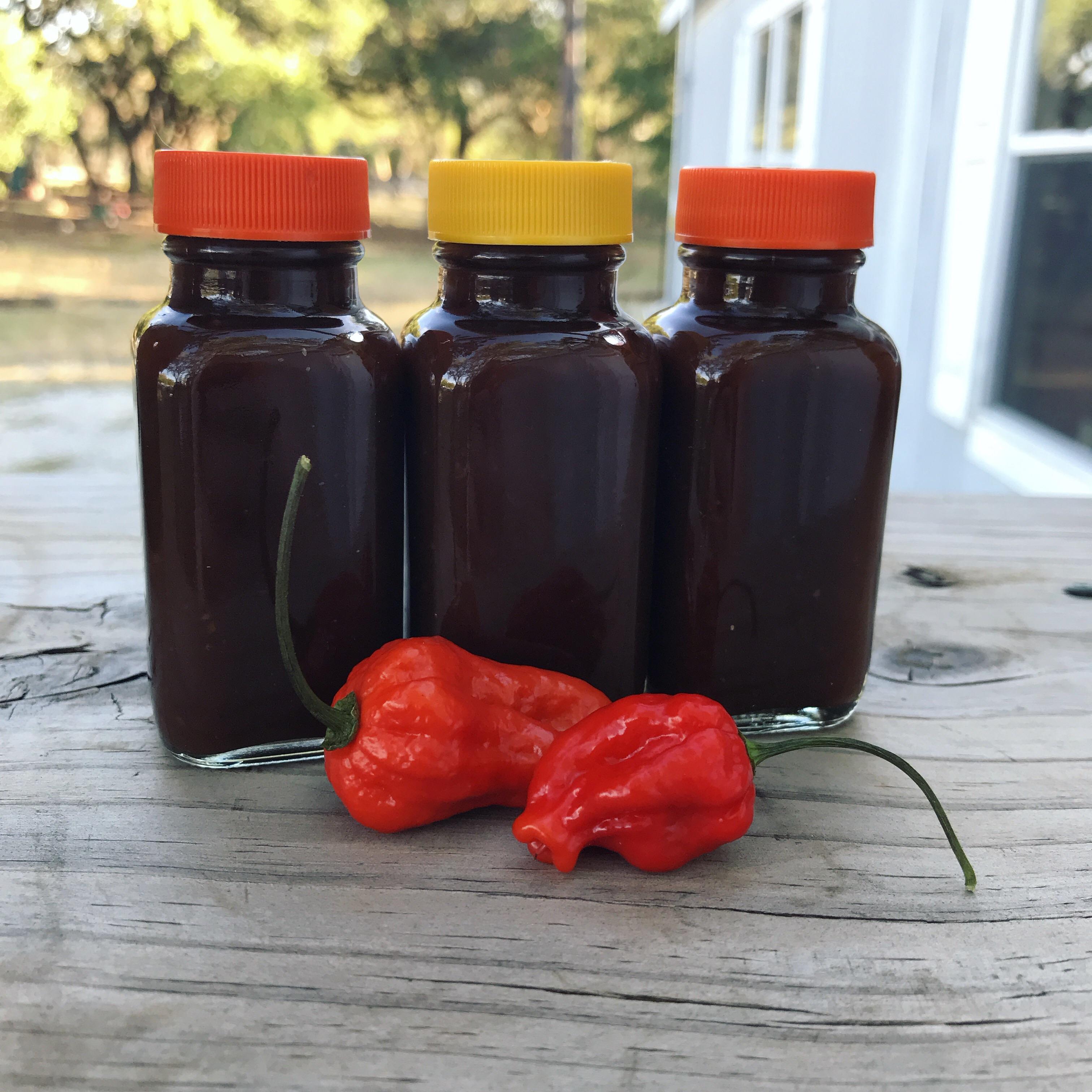 Small batch of ghost pepper hot sauce with black truffle oil, black