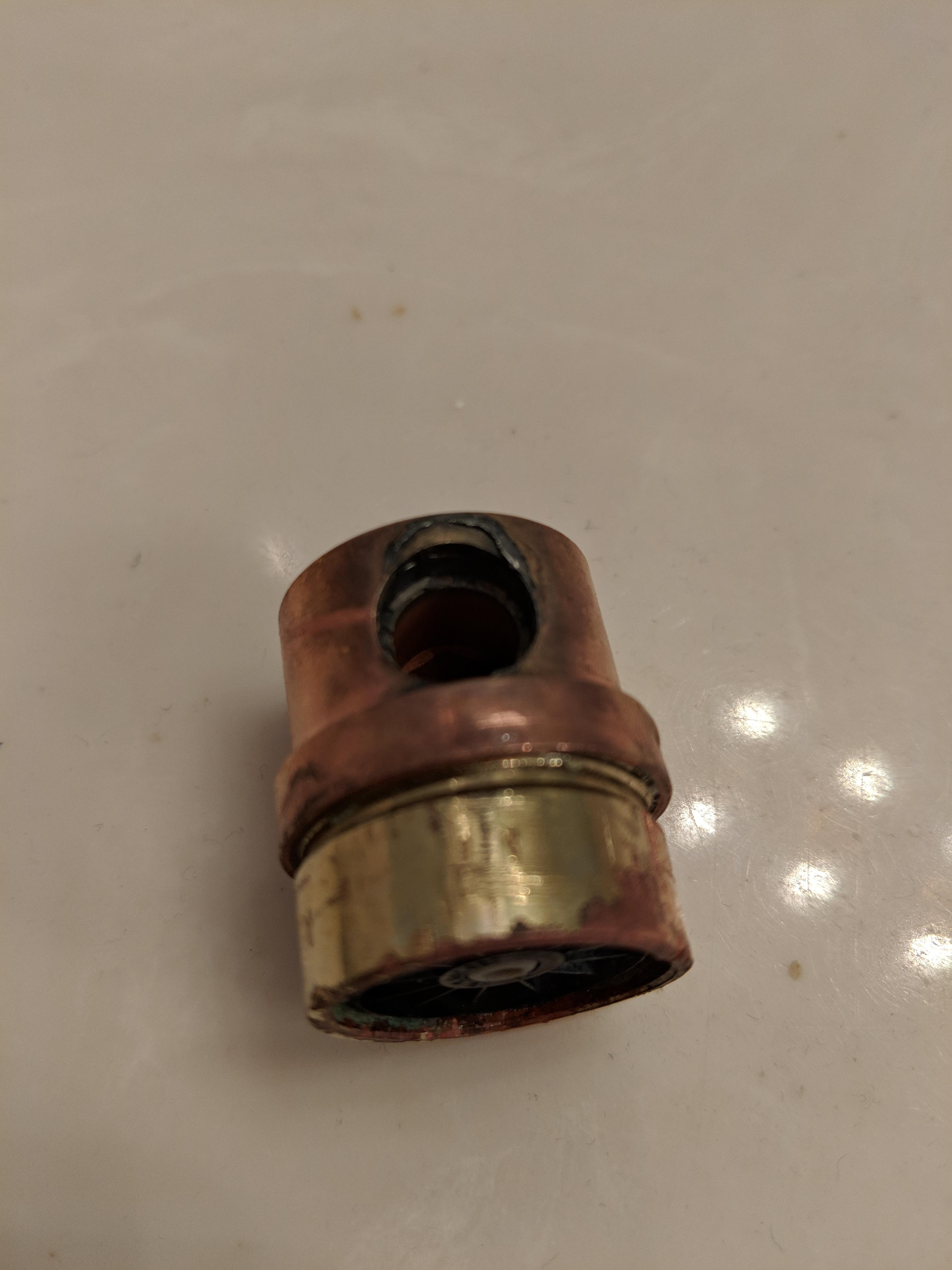 Removed the aerator from a bathroom sink to clean it, but I'm unable to