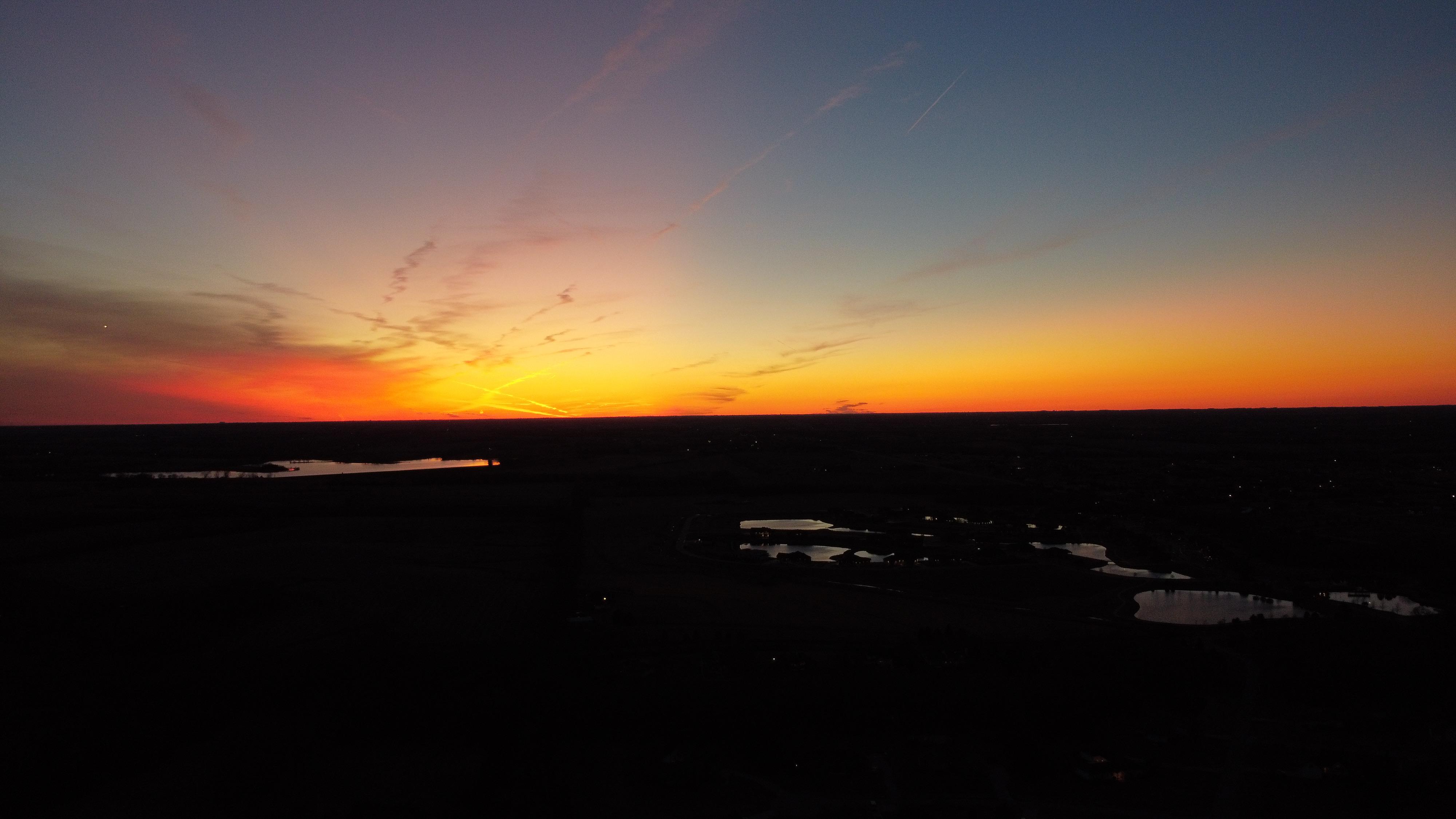 Quick drone shot of the sunset from my far SW Lincoln neighborhood. Yankee Hill lake top left