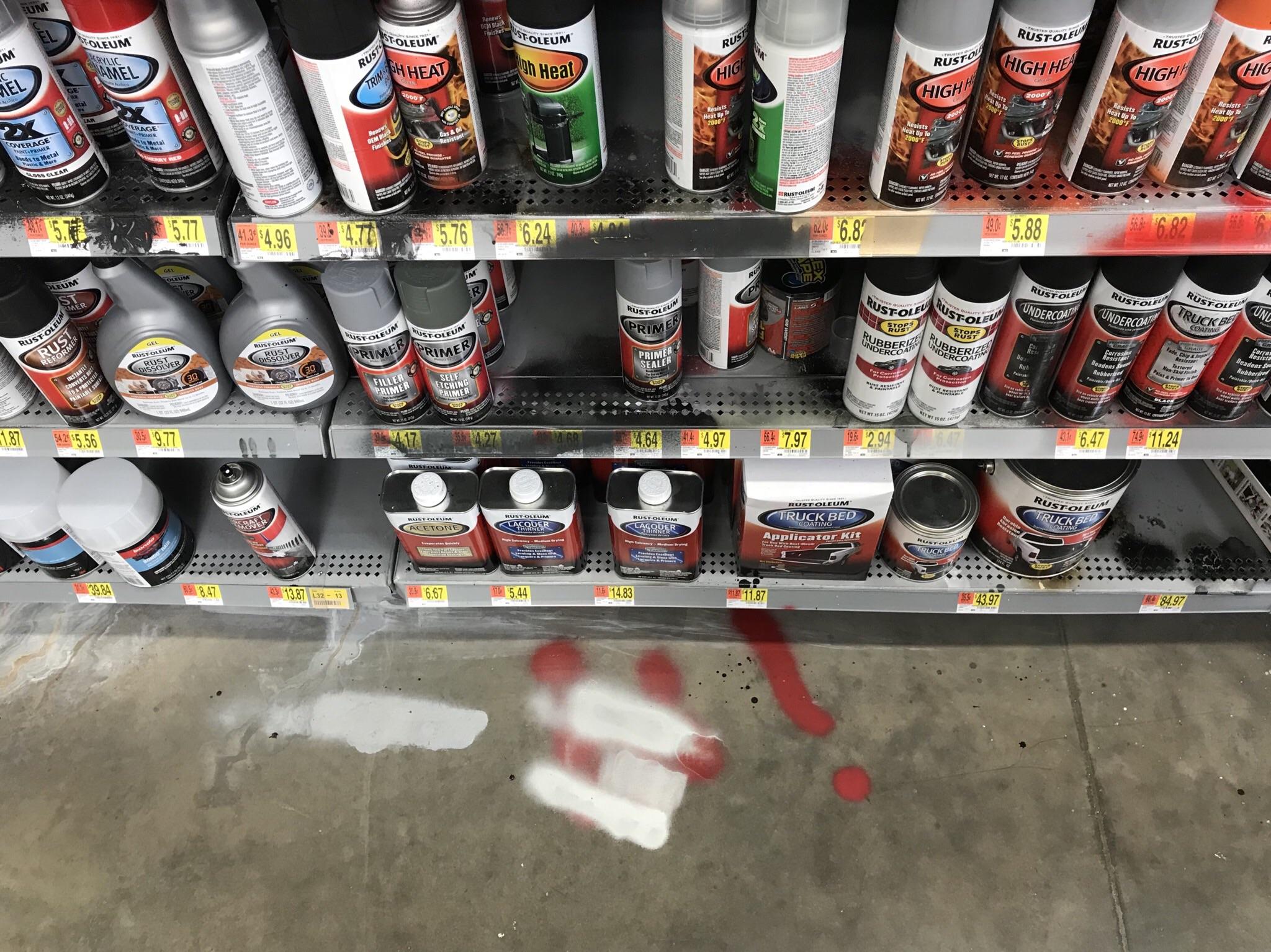 The floor of a Walmart in the paint aisle. r/trashy