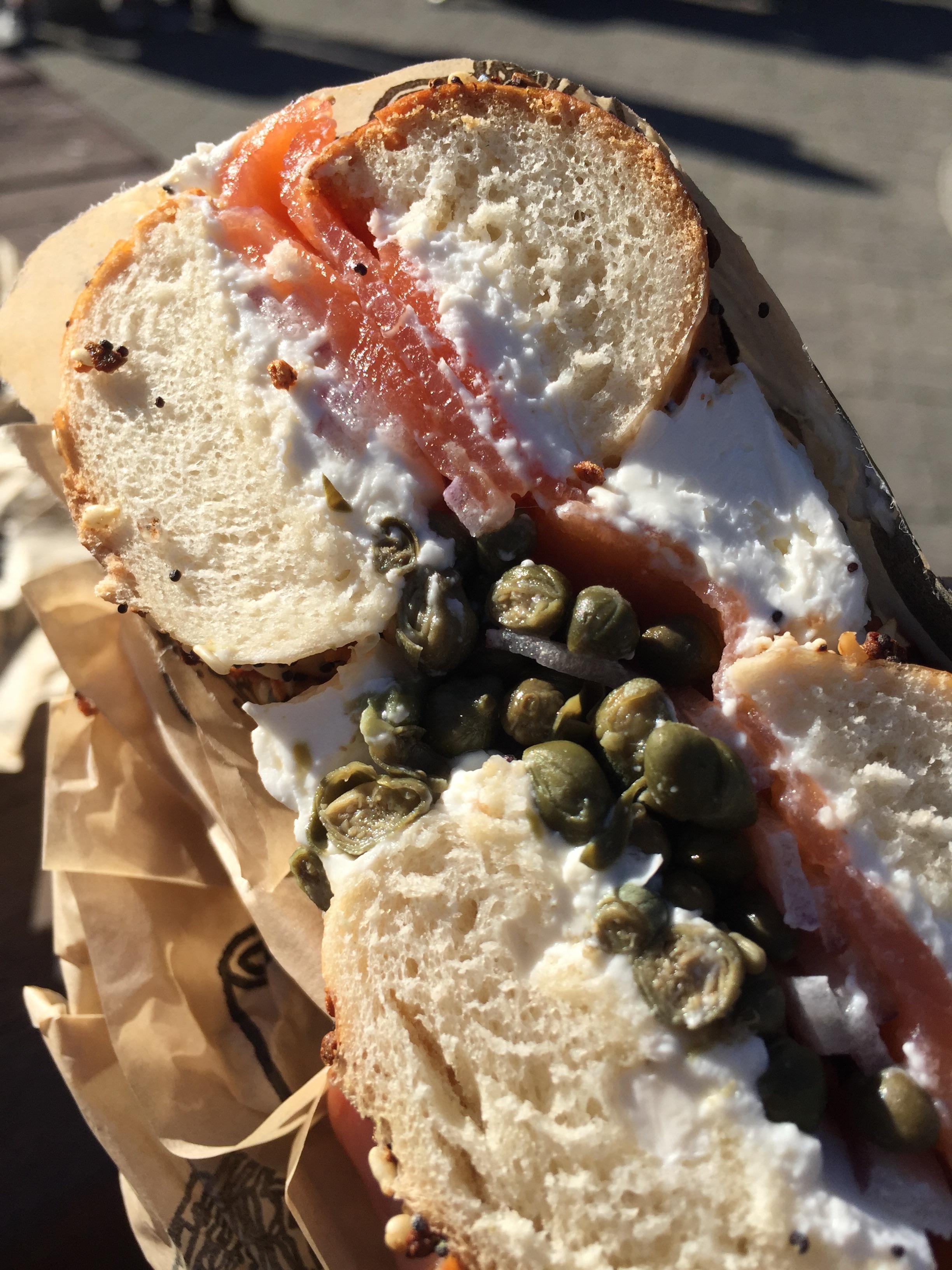 [I ate] Bagel sandwich with smoked salmon, capers, red onions, and