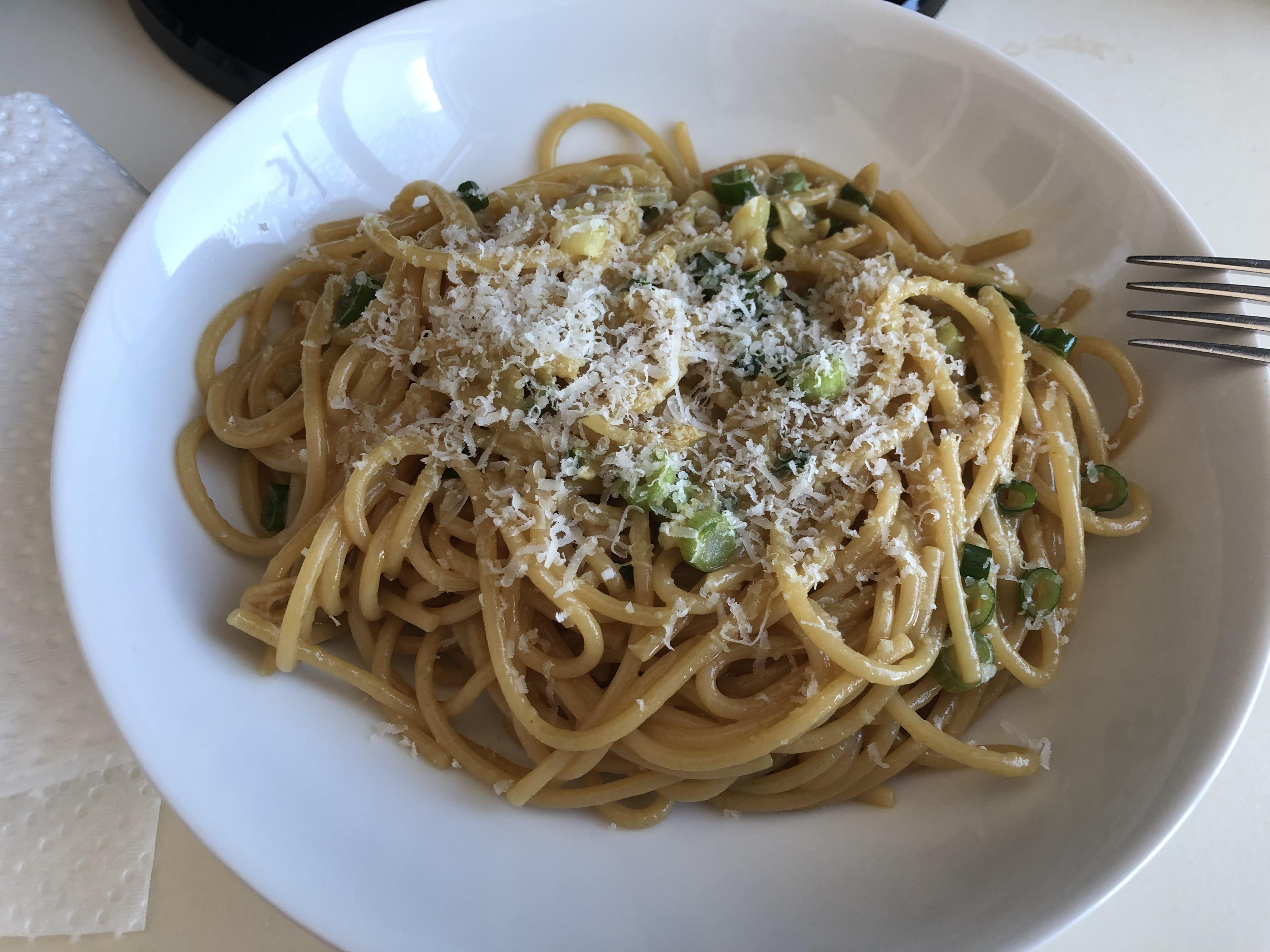 ChineseItalian fusion Asian garlic noodles with soy, oyster sauce, tumeric, parmesan and