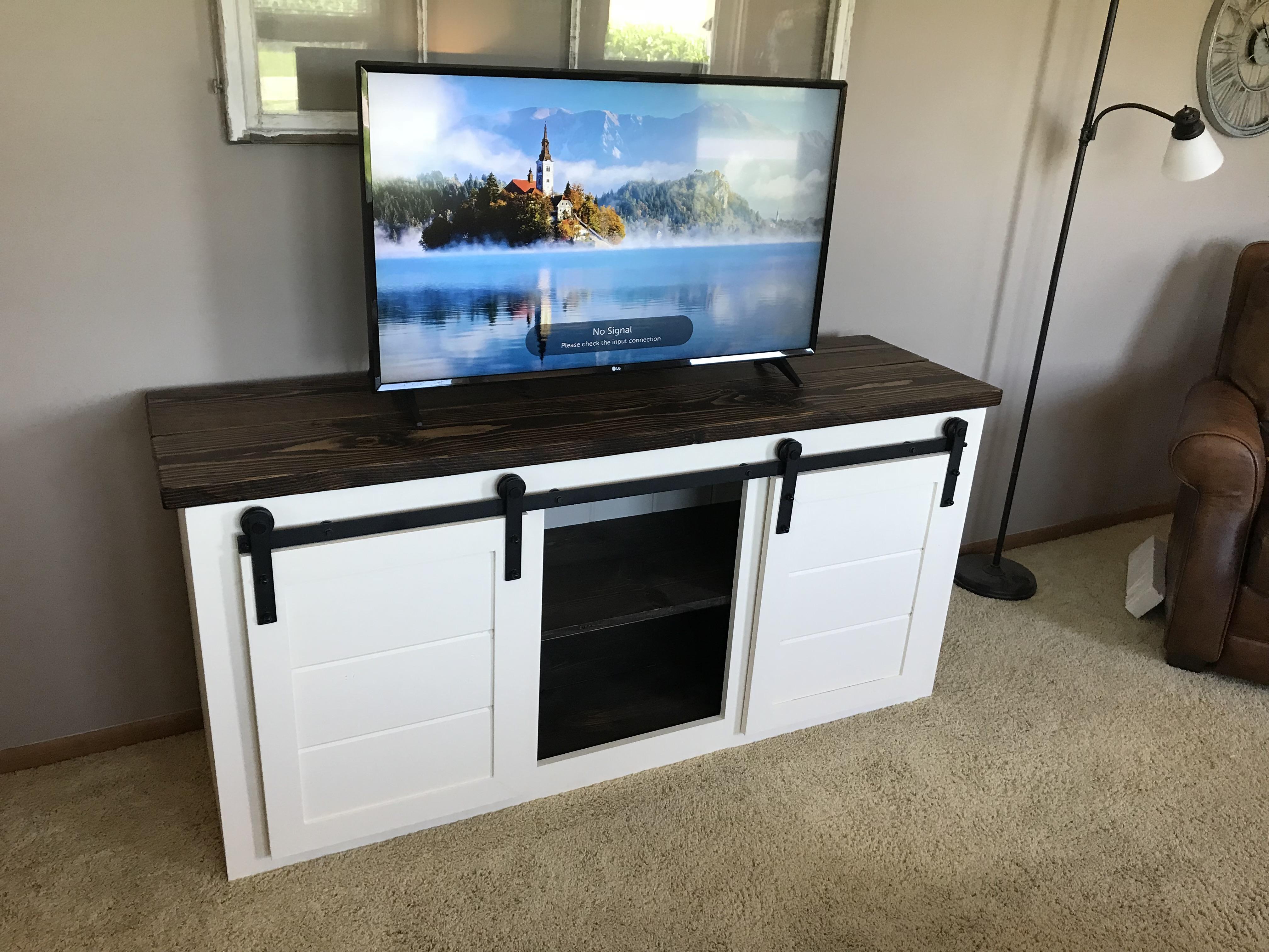 Finally finished the barn door entertainment center I started 4 weeks