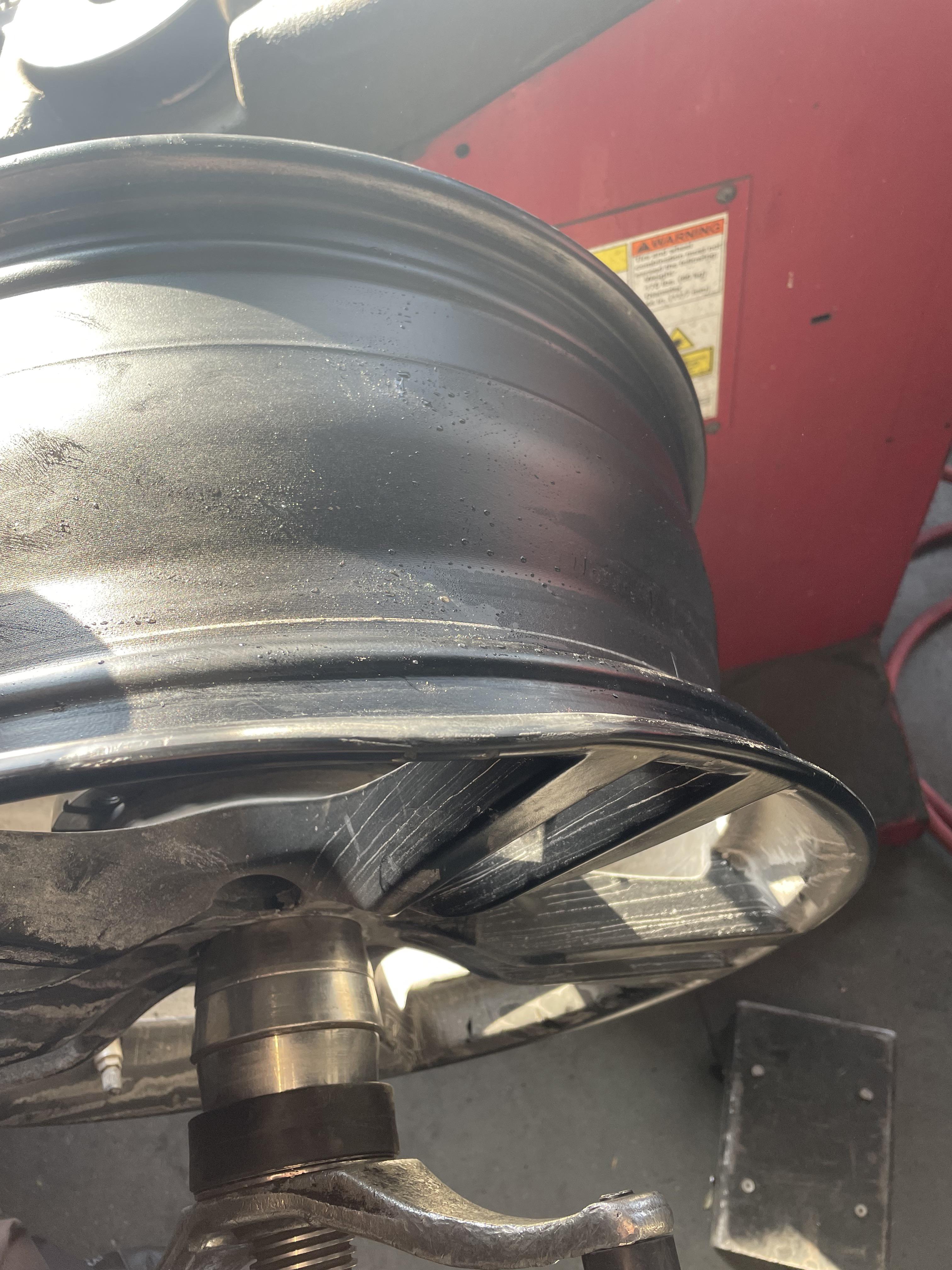 Can I drive on this bent wheel without causing more problems? Tire shop