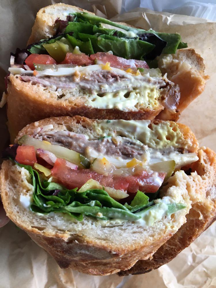 roast beef with pepper jack, pickle, sweet peppers, onion, lettuce, tomato and slathered with