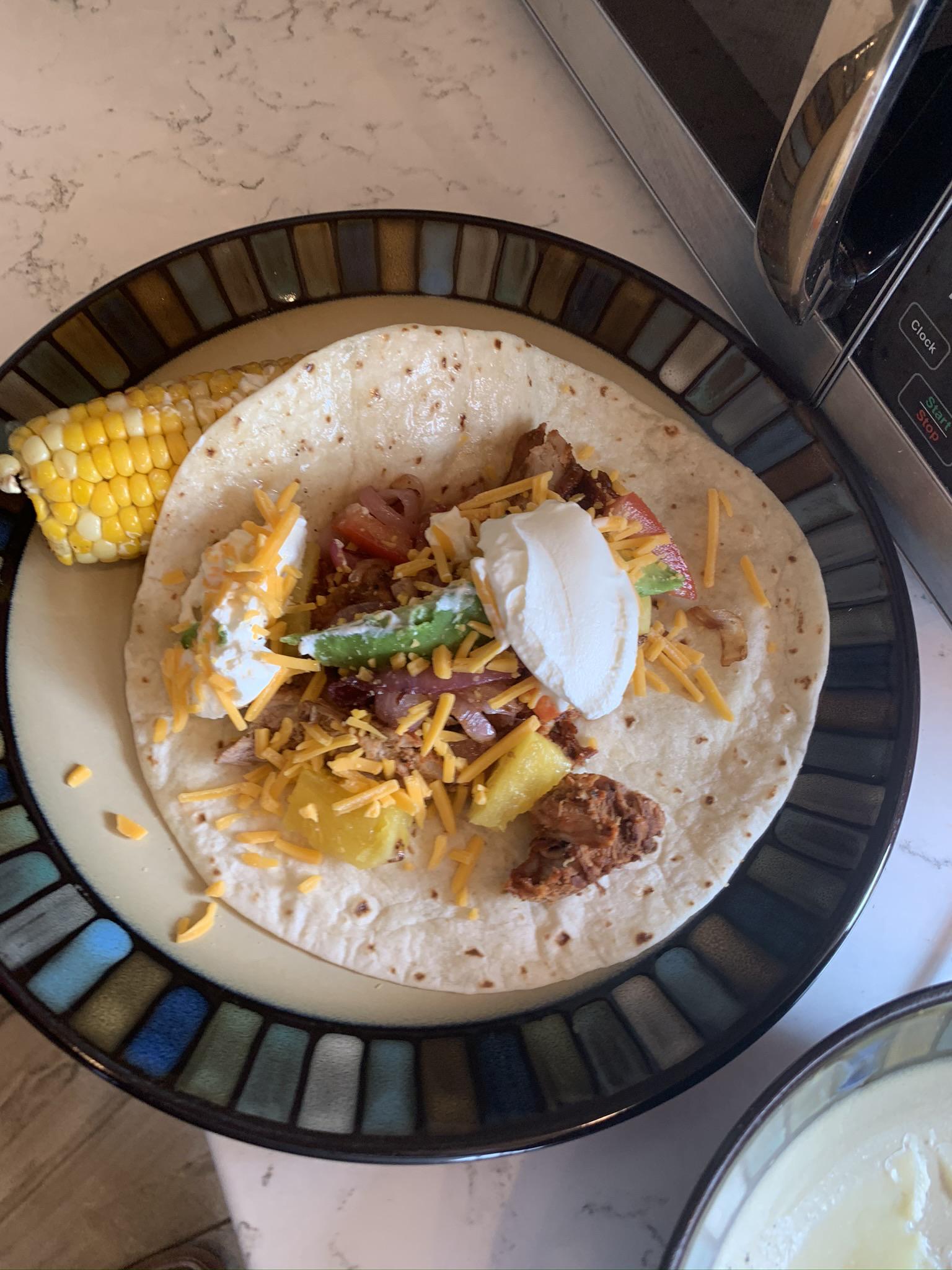 "Tacos al Pastor with pork tenderloin in Adobe sauce, pineapple and