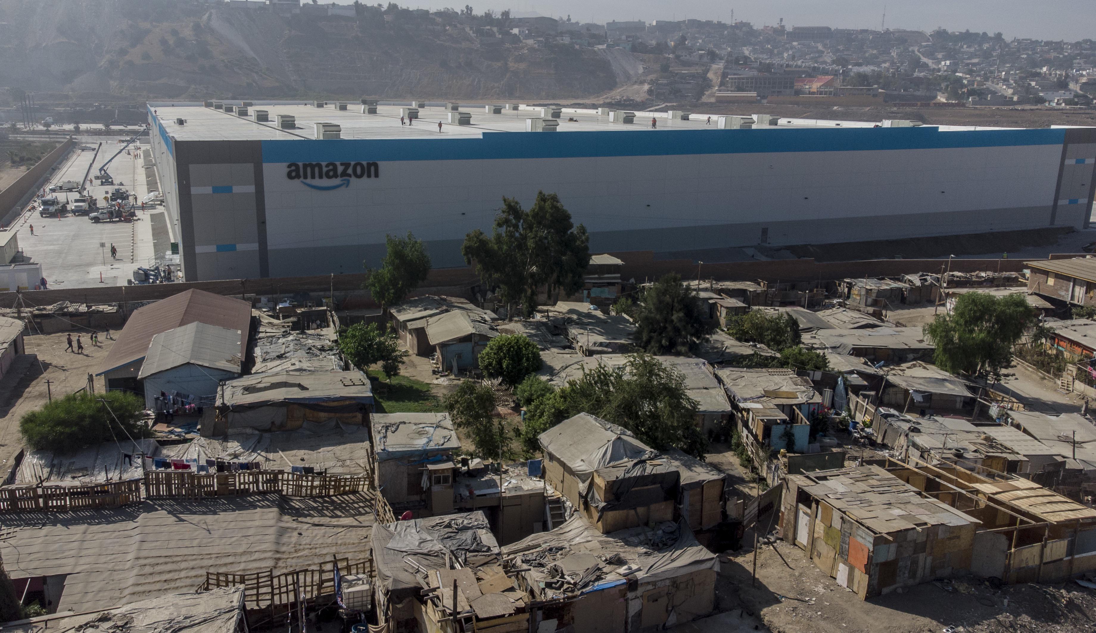 Amazon warehouse next to Tijuana slums 99_rebellion