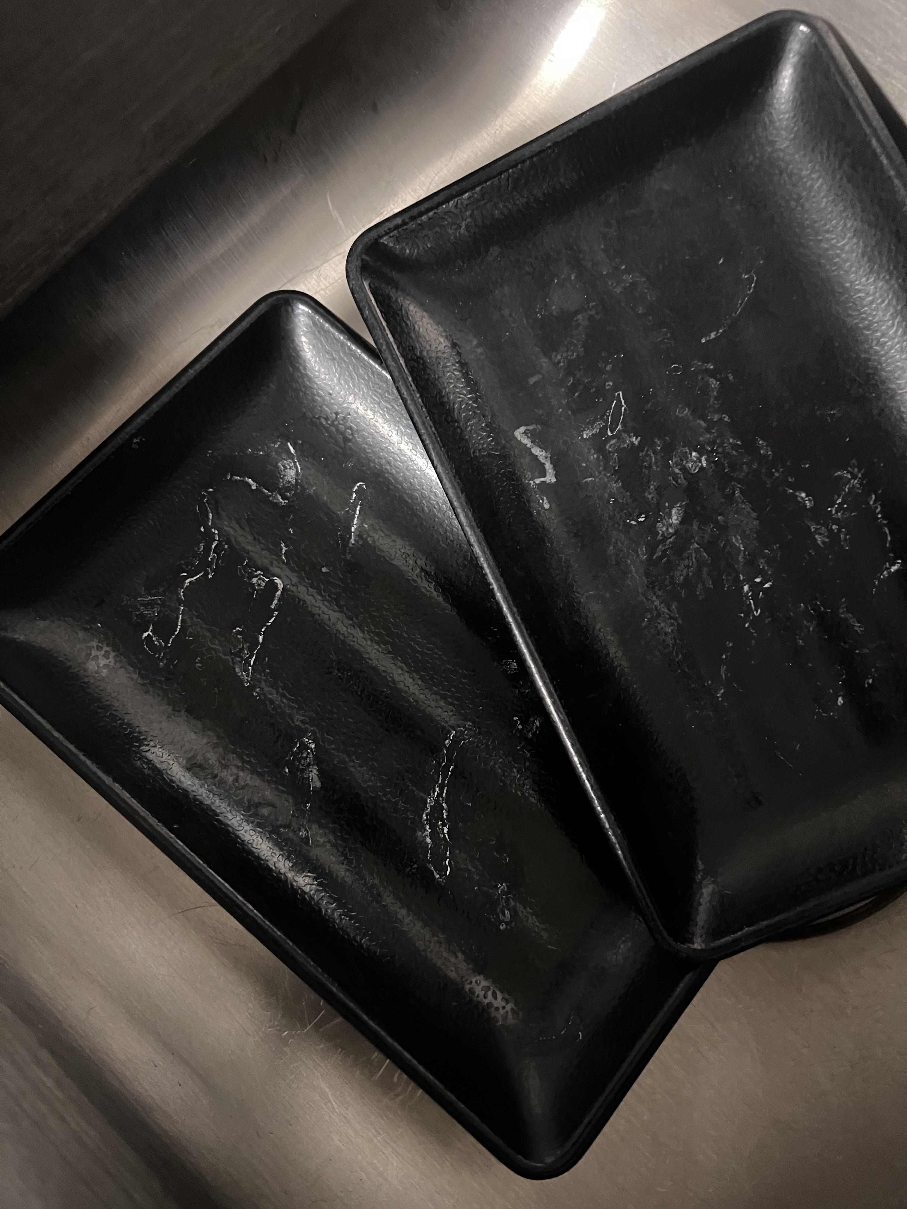 NEED HELP!! White stains on black dishes won’t come out. What are they