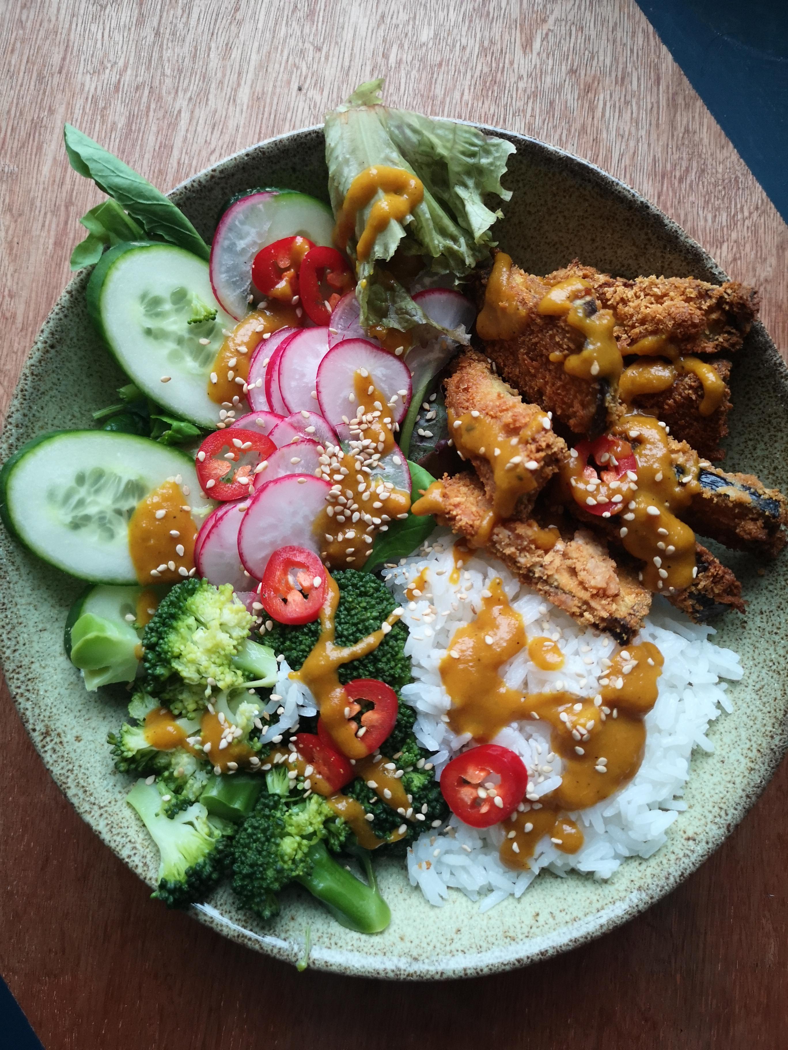 Aubergine katsu curry with steamed jasmine rice and broccoli, salady