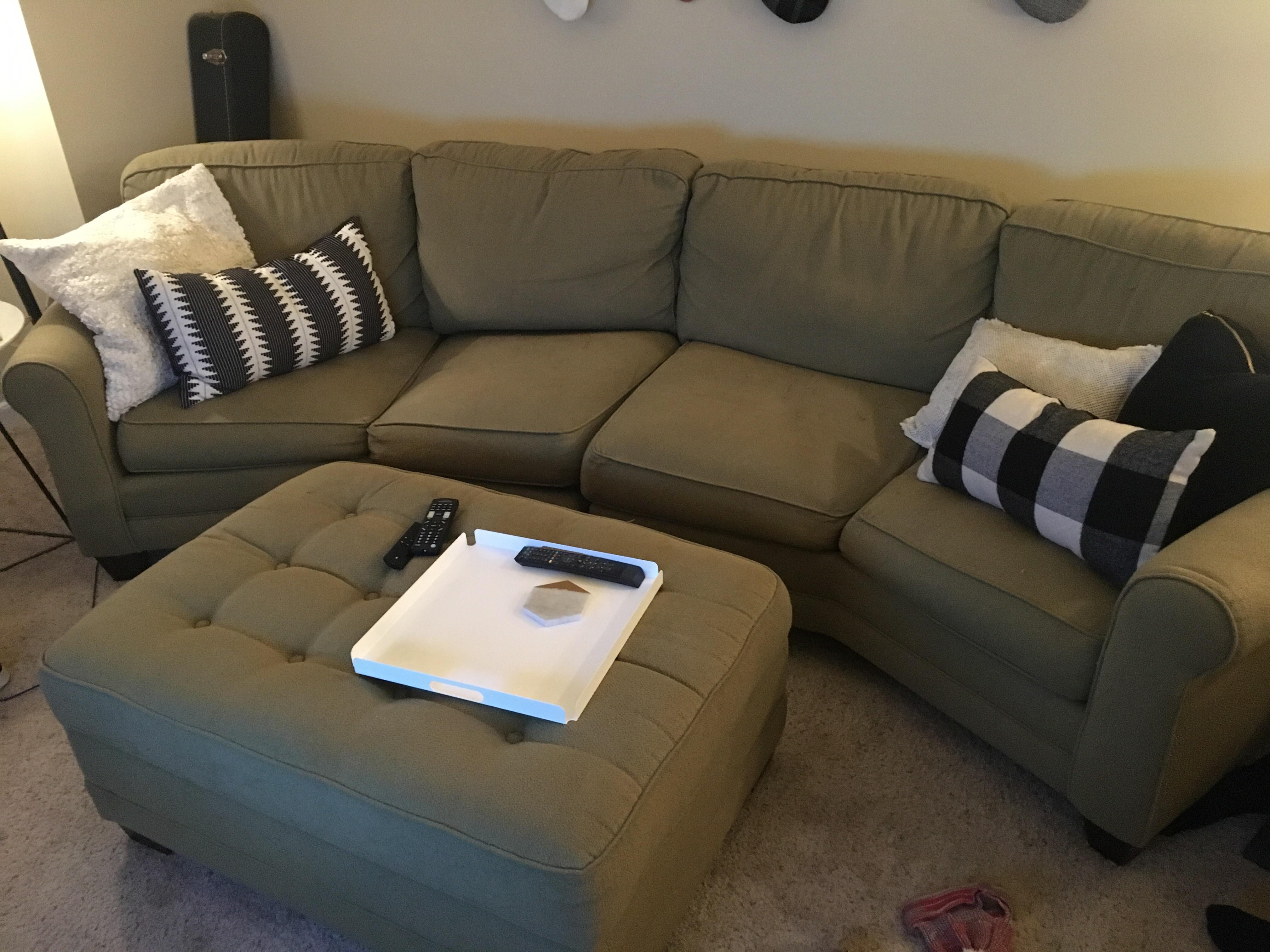 Free couch and storage ottoman. Must pick up. Located in Raleigh