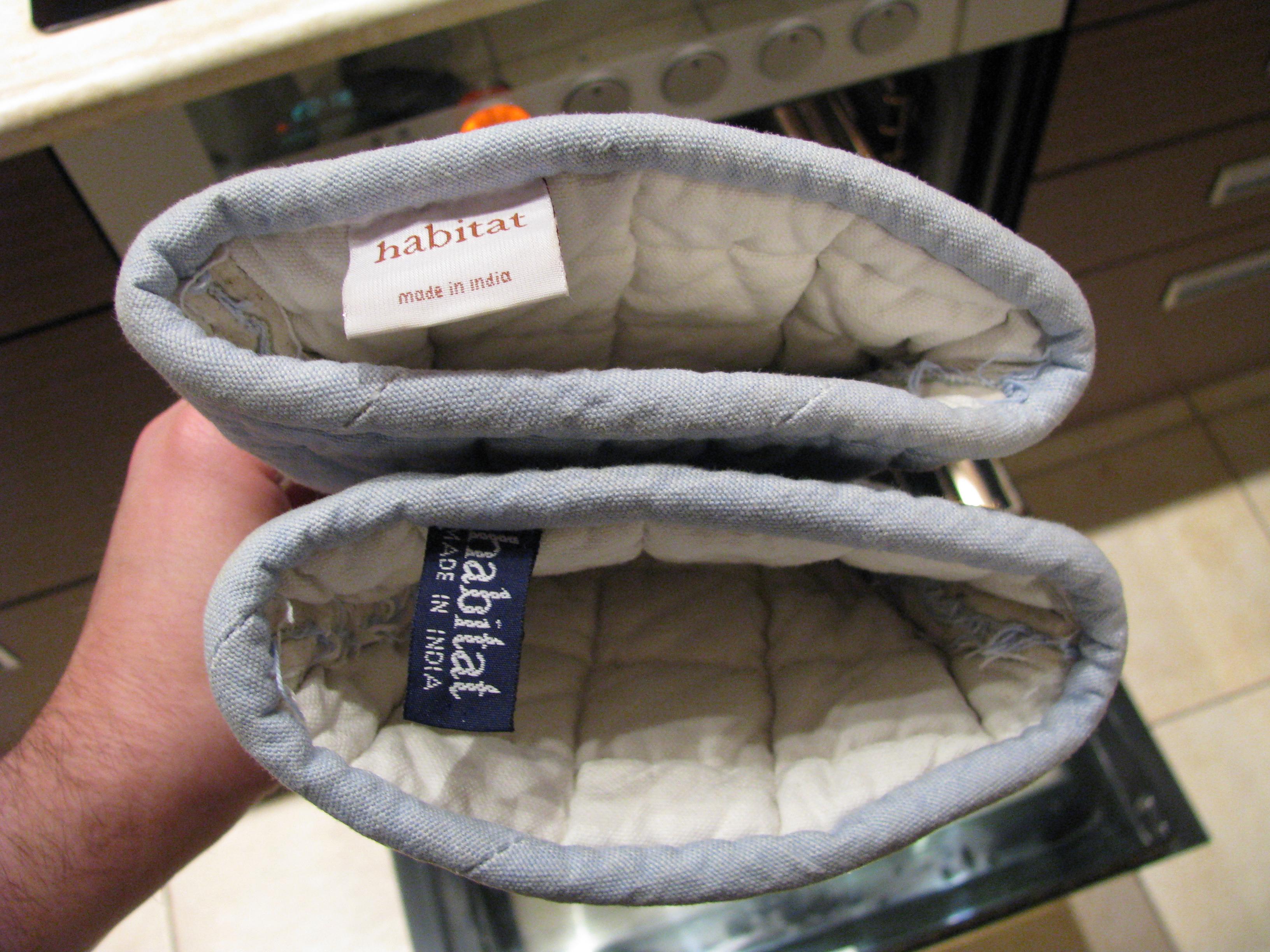 A pair of oven mitts I own has two different tags. r/mildlyinteresting