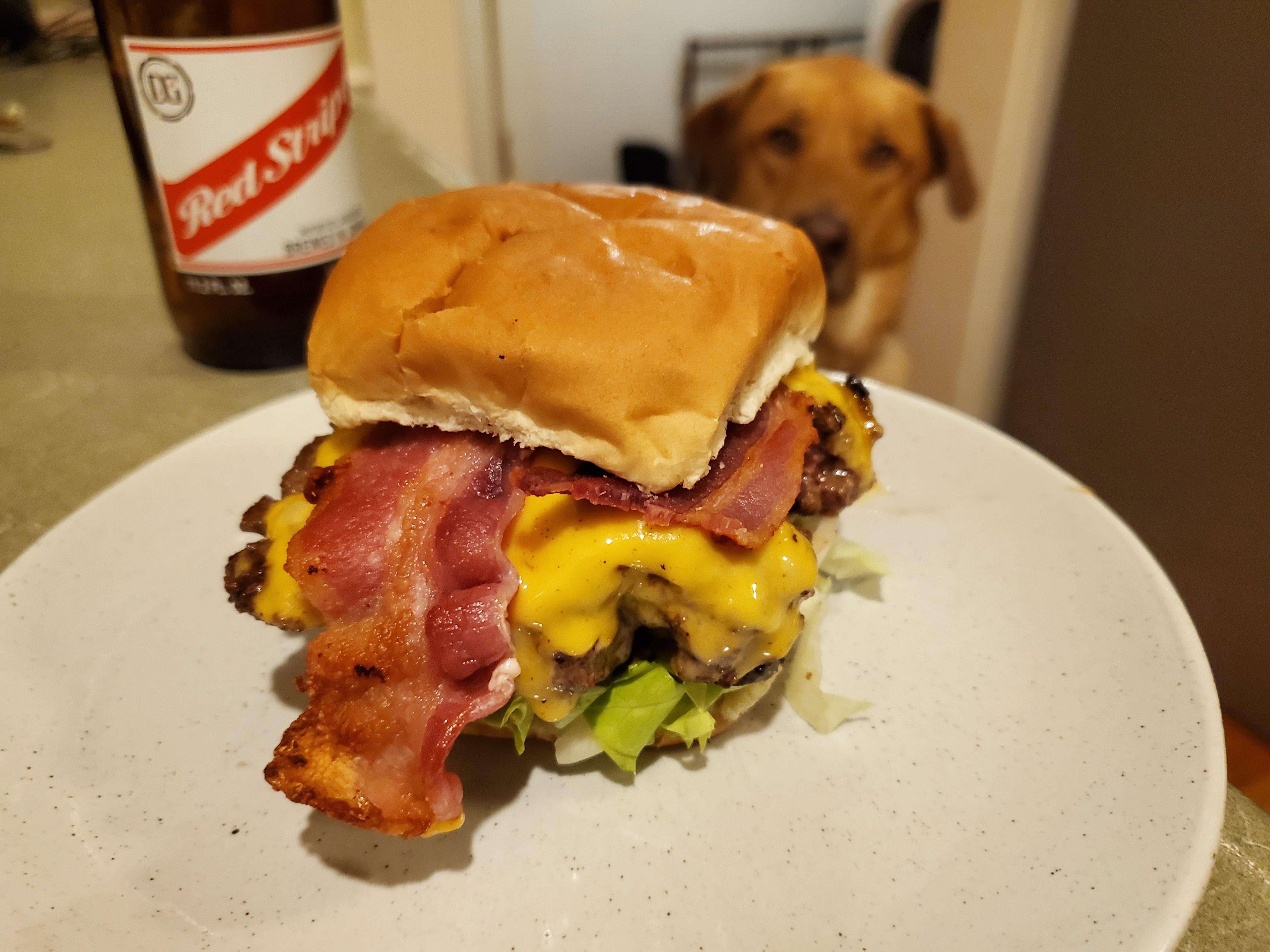 Homemade short rib and chuck burger smashed style in cast iron for a