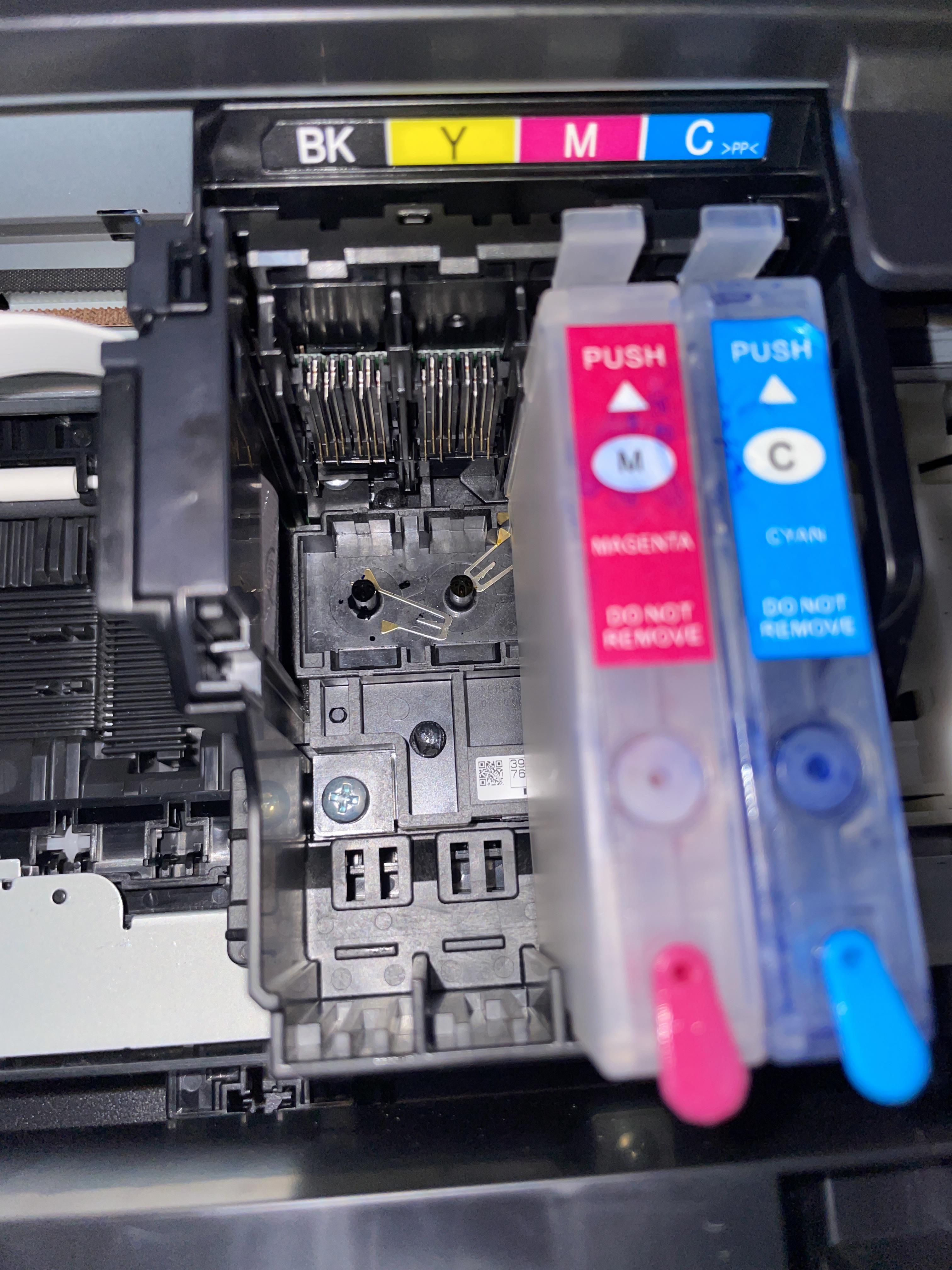 I added refillable ink cartridges to my Epson XP4100 and it said