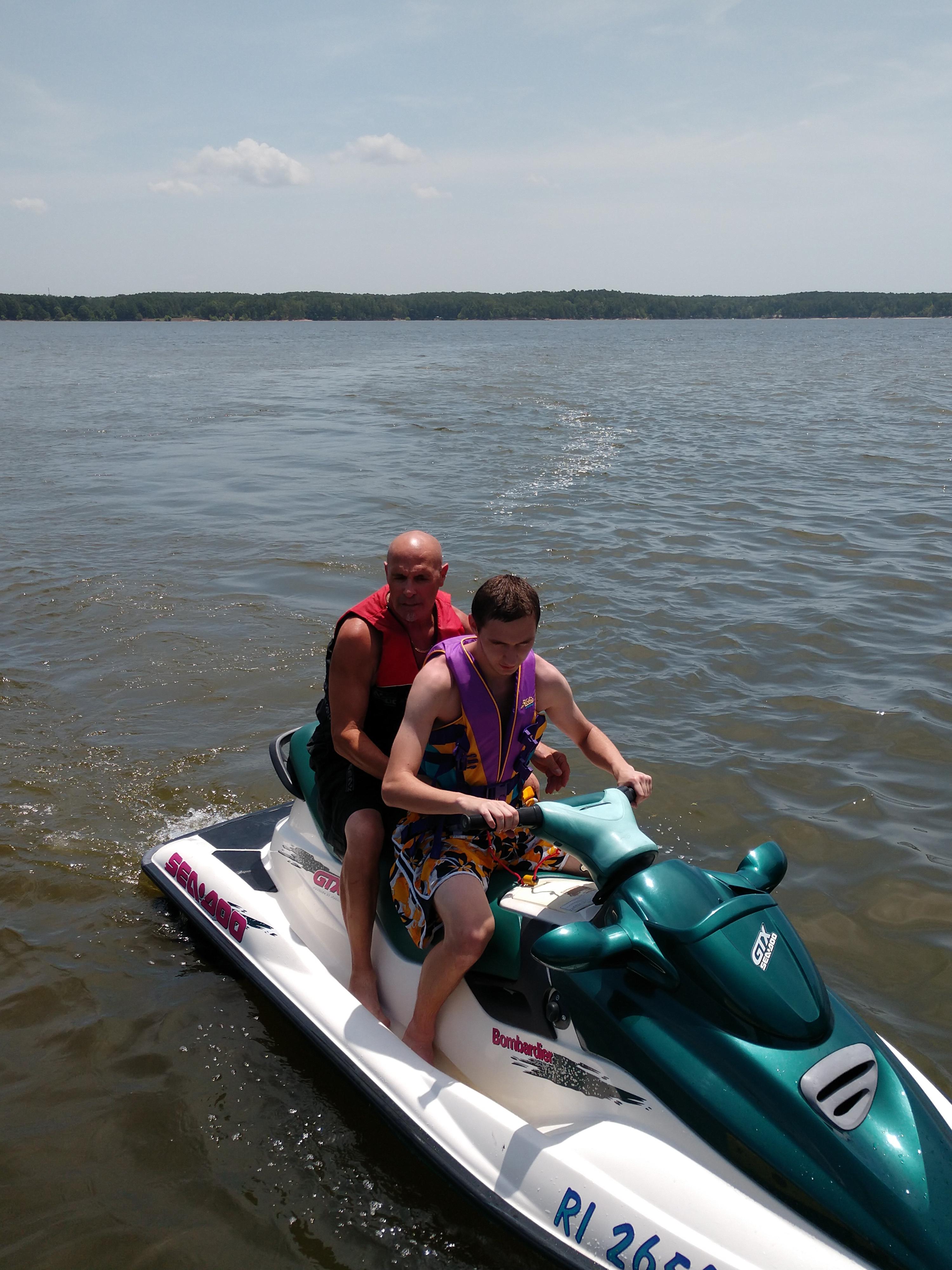 PsBattle Two guys riding a jetski