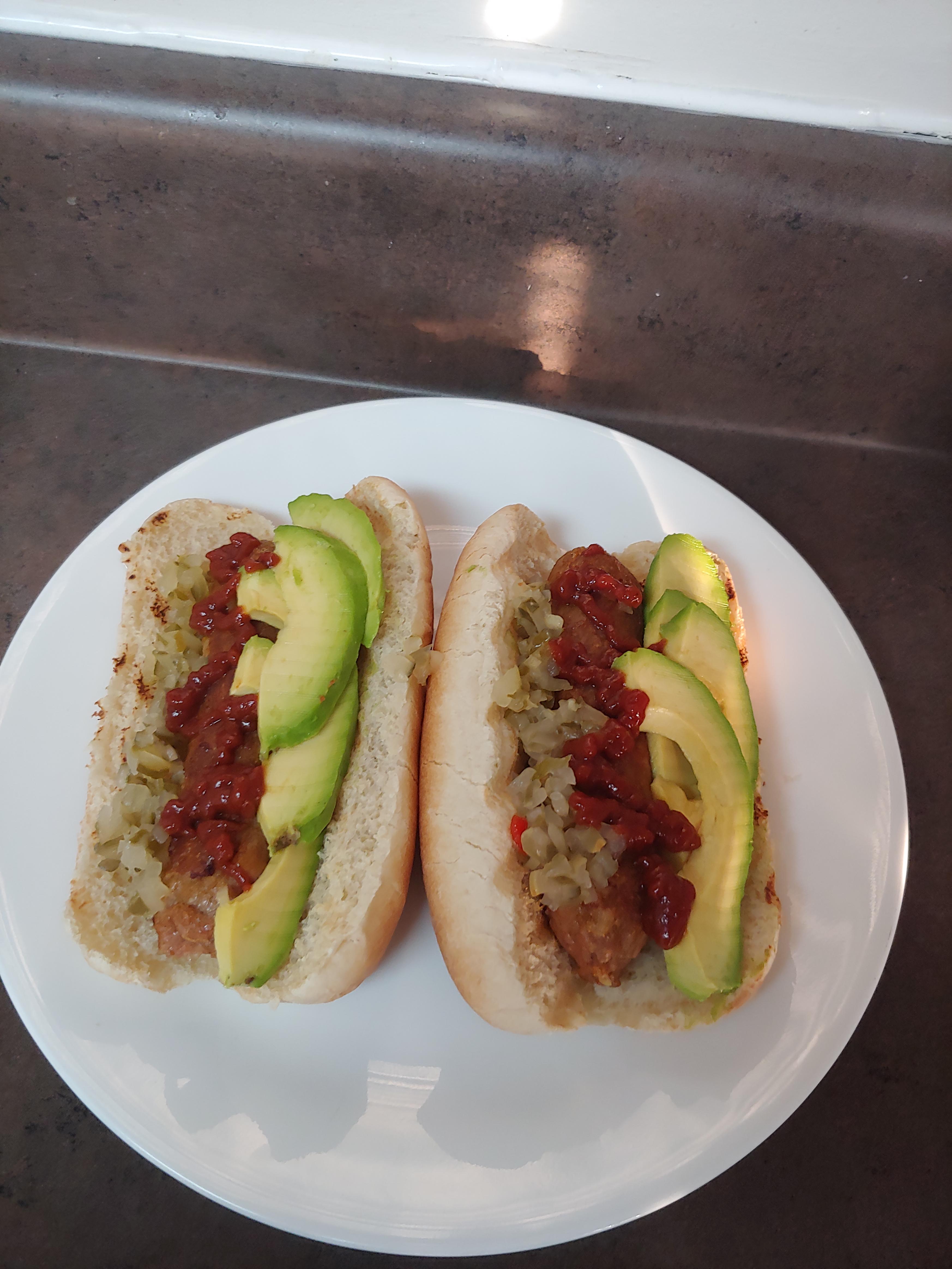 Vegan beyond sausages with spicy ketchup, avocado and relish r