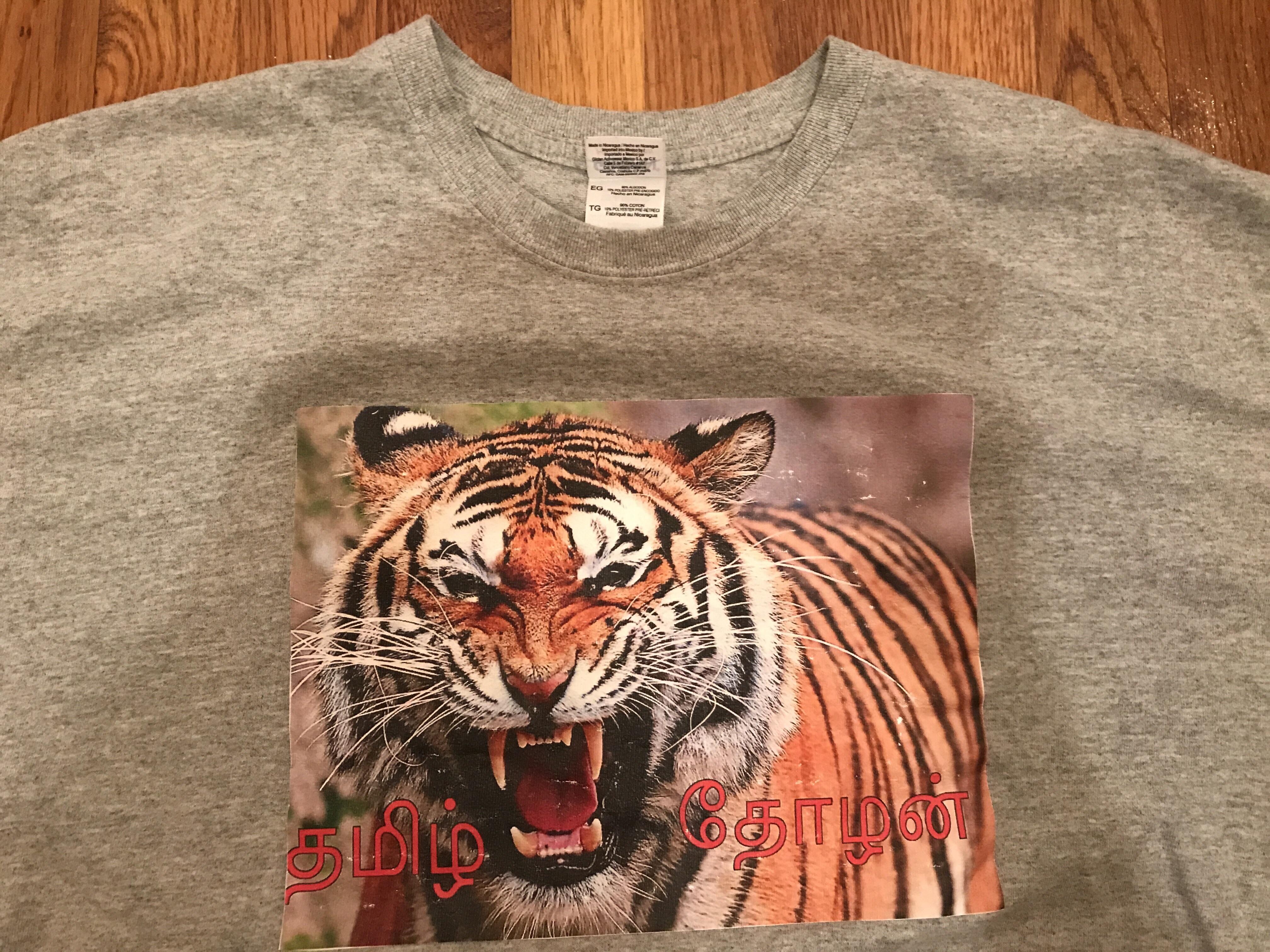 [Tamil > English] one of my favorite shirts. any ideas? r/translator