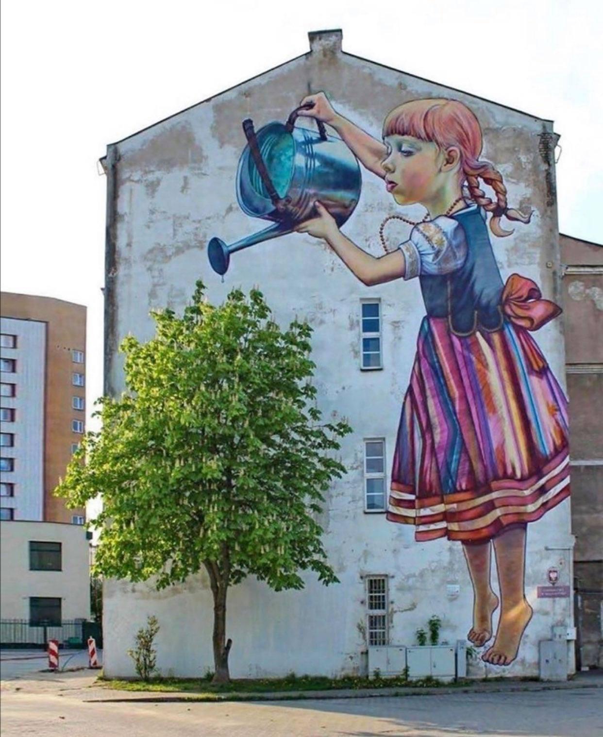 Girl with a Watering Can. Grafitti mural by Natalia Rak in Białystok