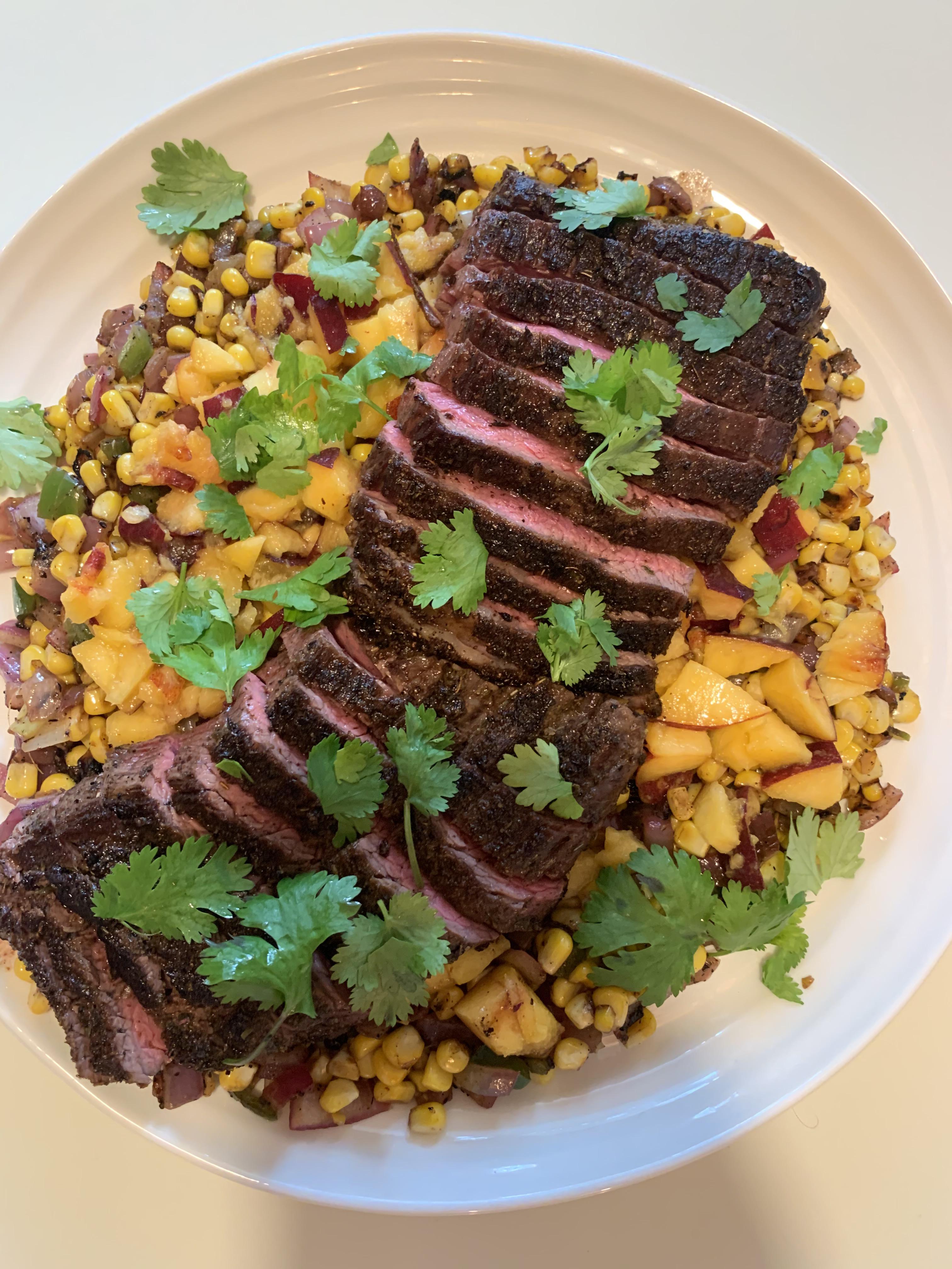 I made skirt steak with spicy cornandpeach salsa! Recipe is from