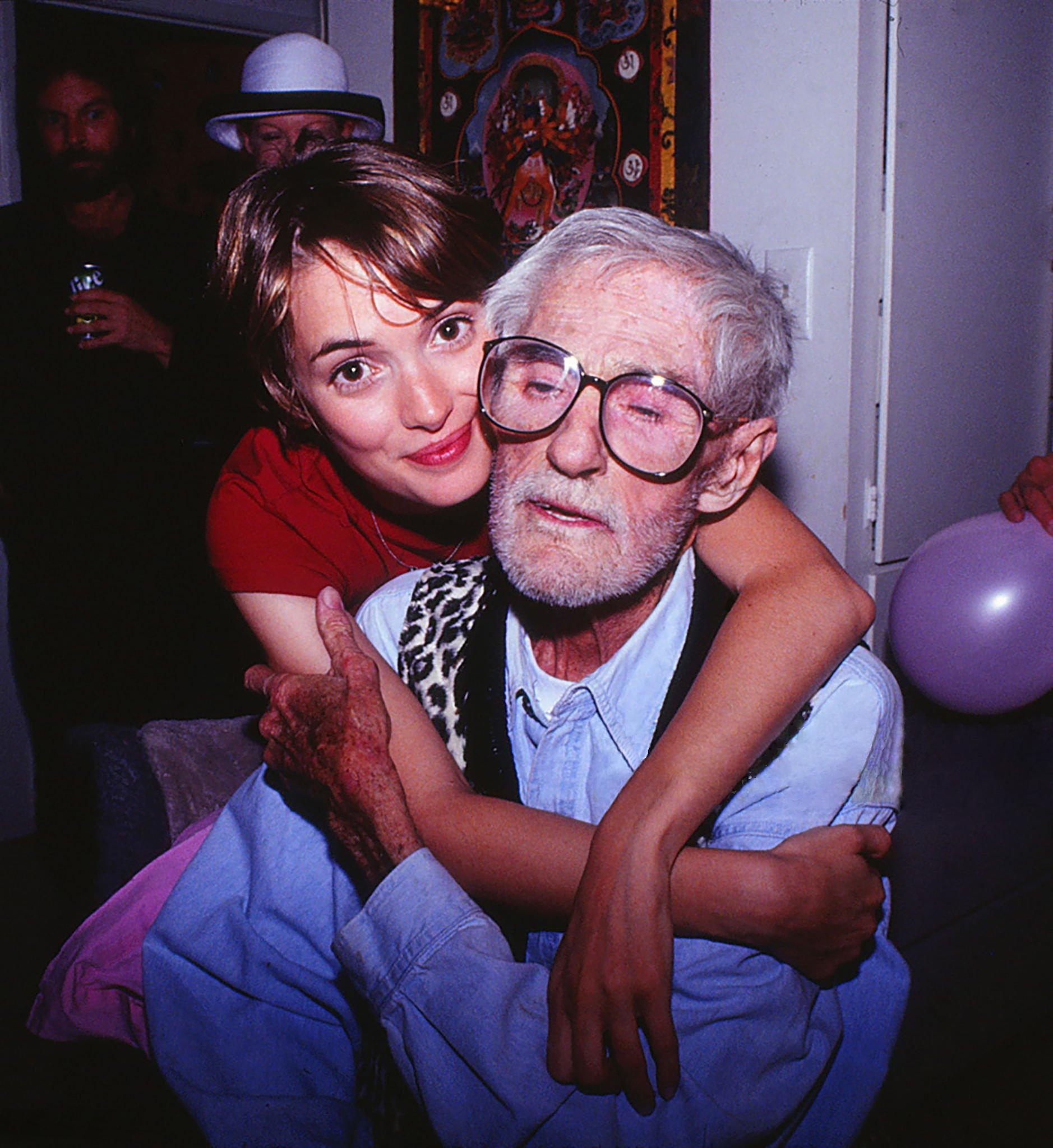Winona Ryder embraces her godfather Timothy Leary at his home on Good