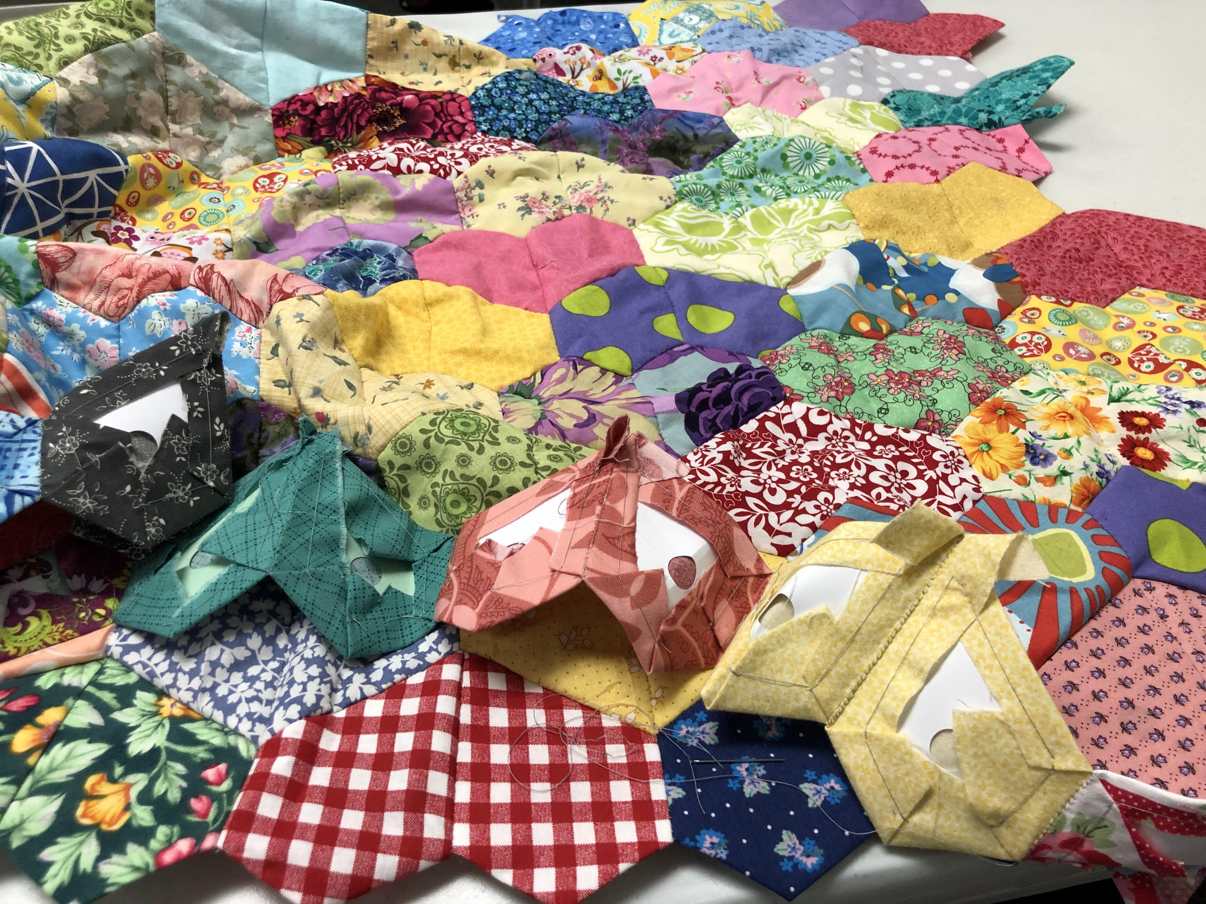 While waiting for kiddo at gymnastics, I work on my EPP quilt. Pattern