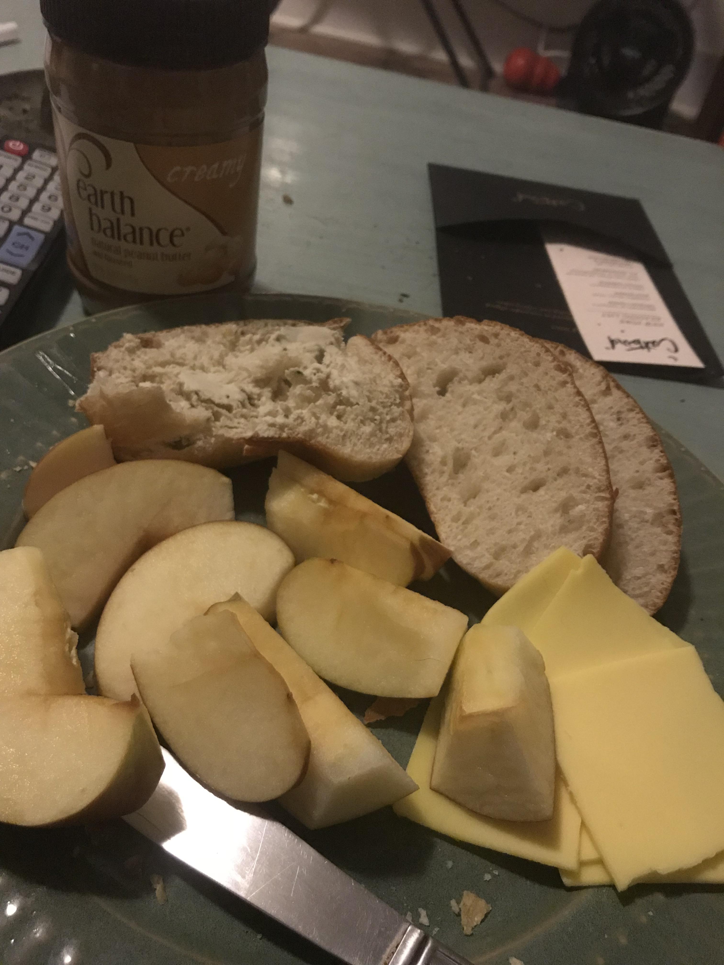 Bread, violife and treeline cheeses, peanut butter, and apple late